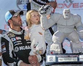 Jimmie Johnson with daughter Genevieve Marie after winning at Dover in June