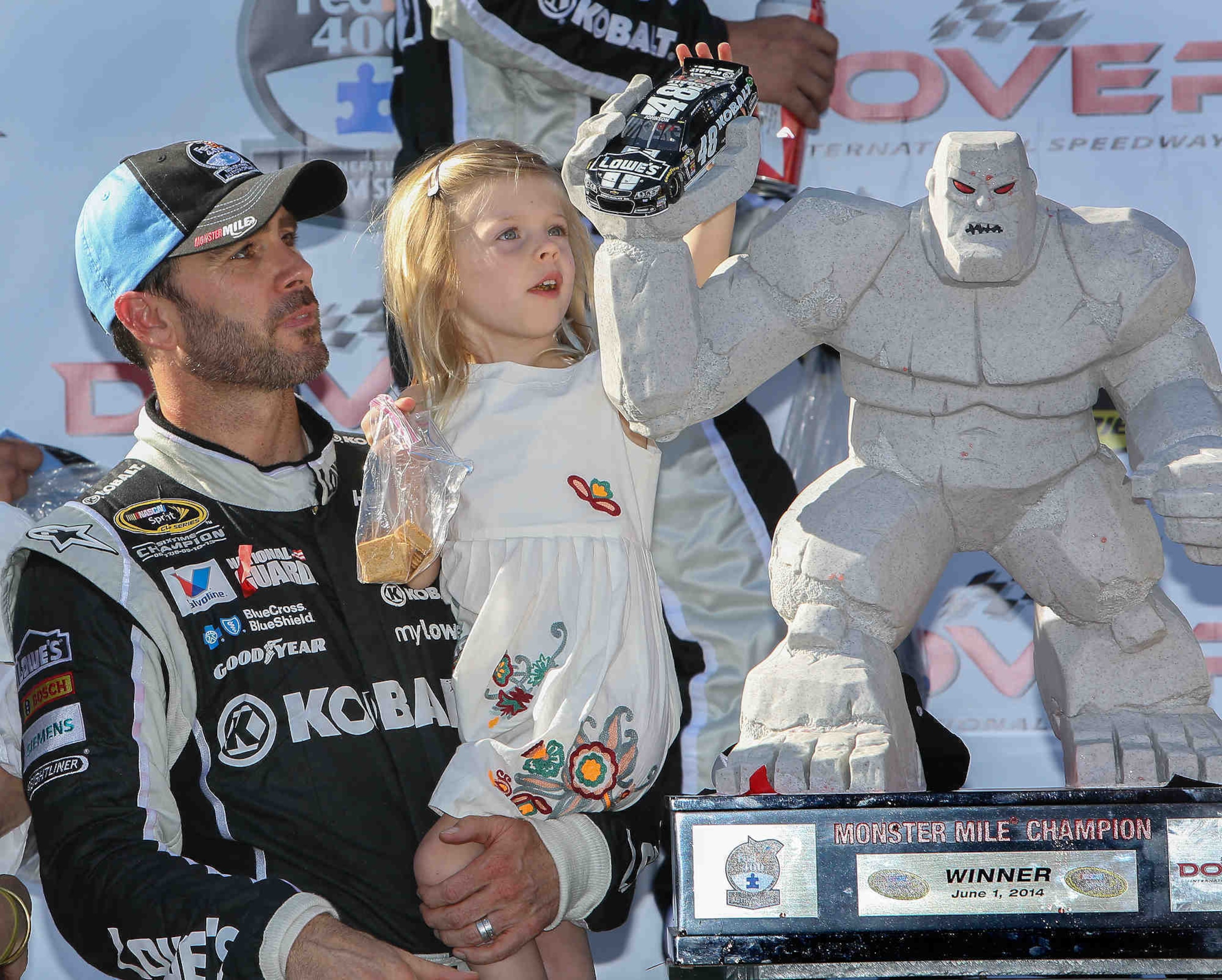 Jimmie Johnson with daughter Genevieve Marie after winning at Dover in June