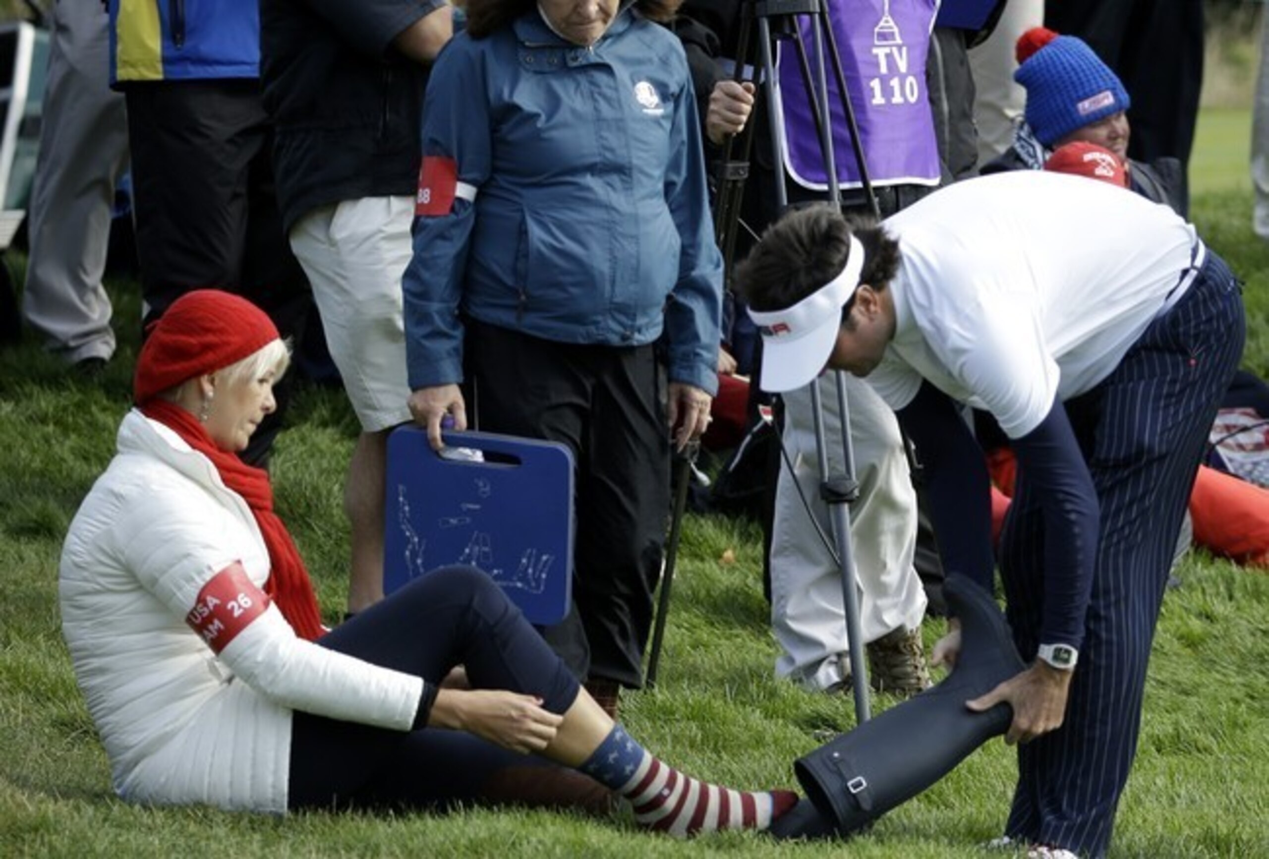 A wayward Bubba Watson shoots meets up with the spectator.