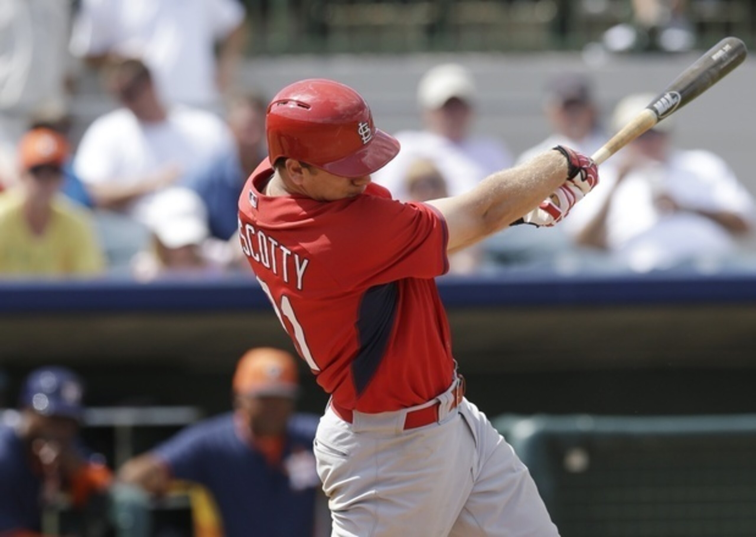 Stephen Piscotty gets a hit in a spring training game against the Astros on March 22.