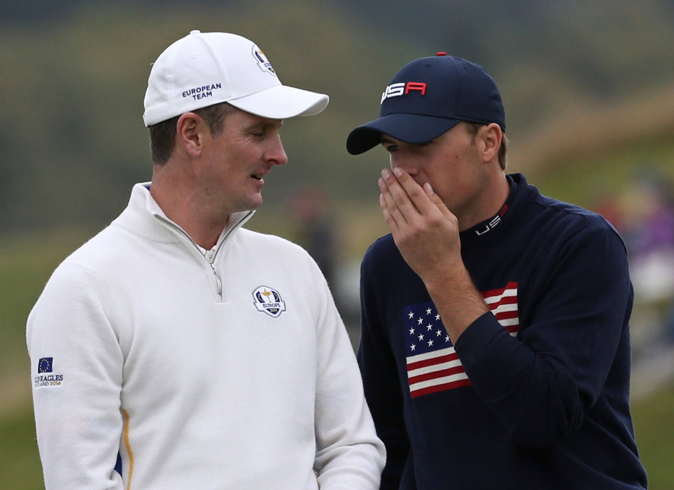 Justin Rose listens as Jordan Spieth tries to ease some tension.