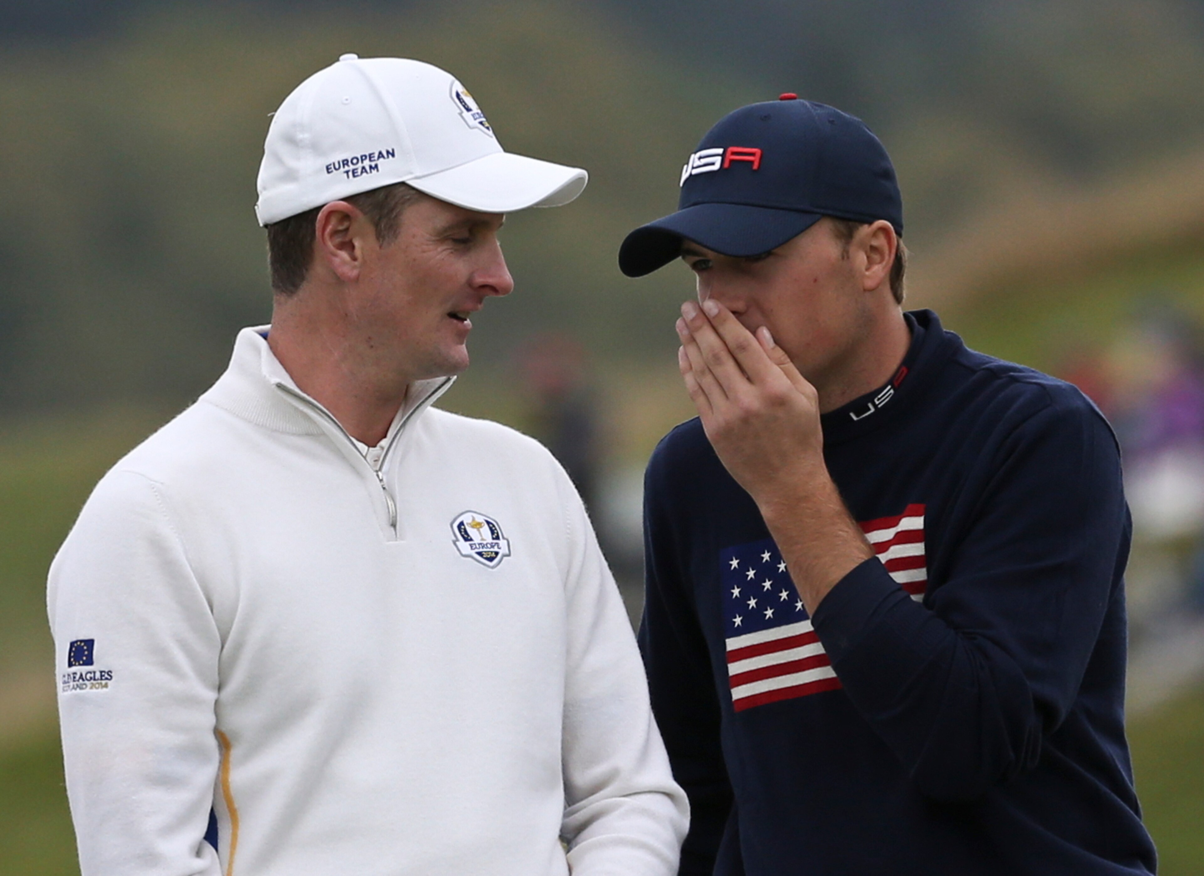 Justin Rose listens as Jordan Spieth tries to ease some tension.
