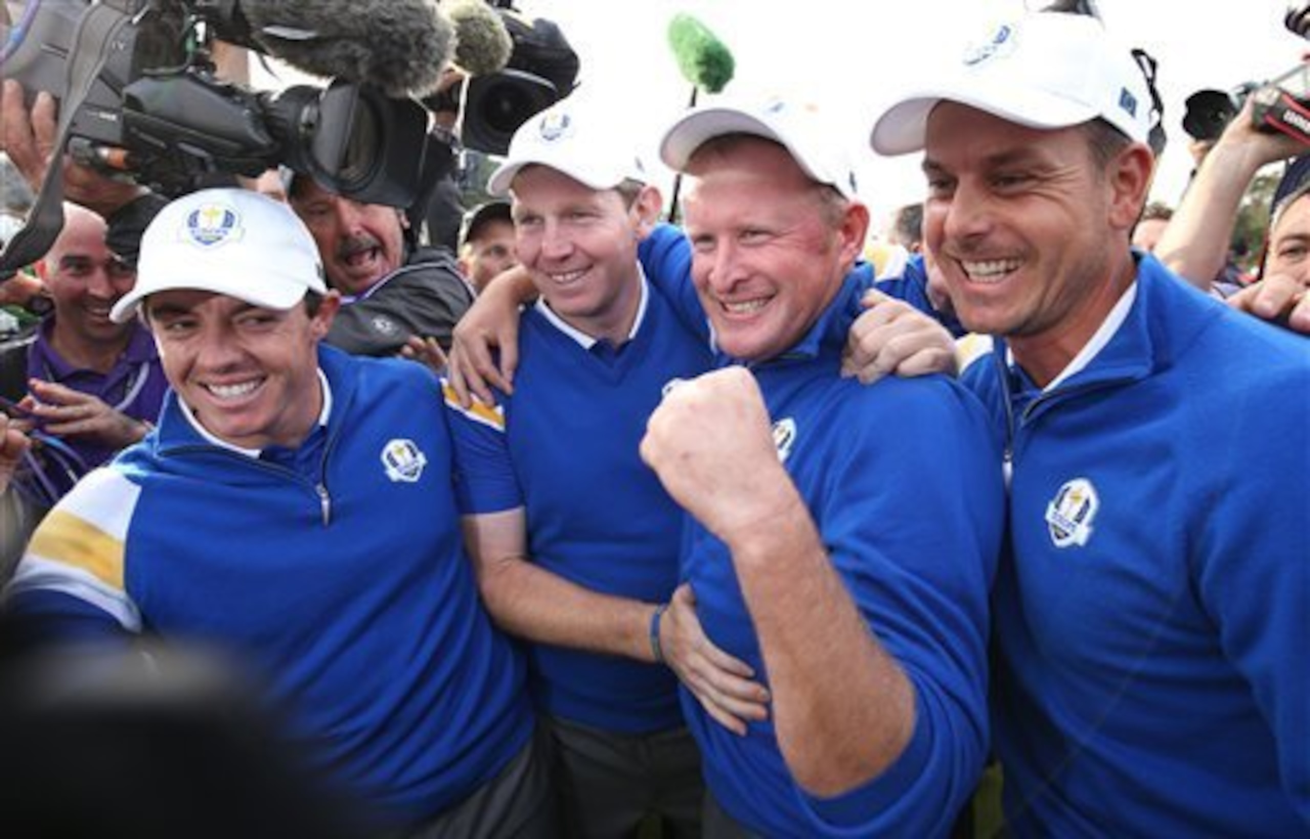 Henrik Stenson (right) joins the celebration.