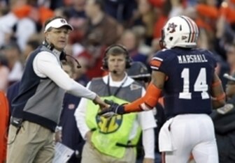 Auburn head coach Gus Malzahn (left) and quarterback Nick Marshall