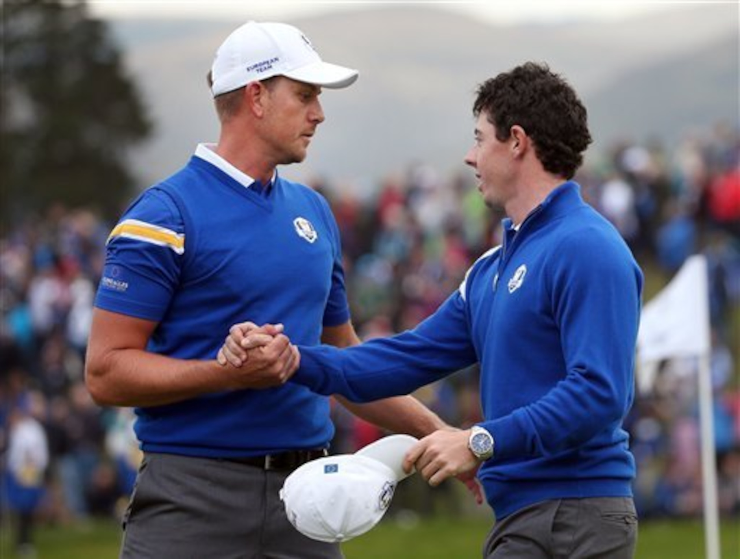 Henrik Stenson gets congratulations from Rory McIlroy.