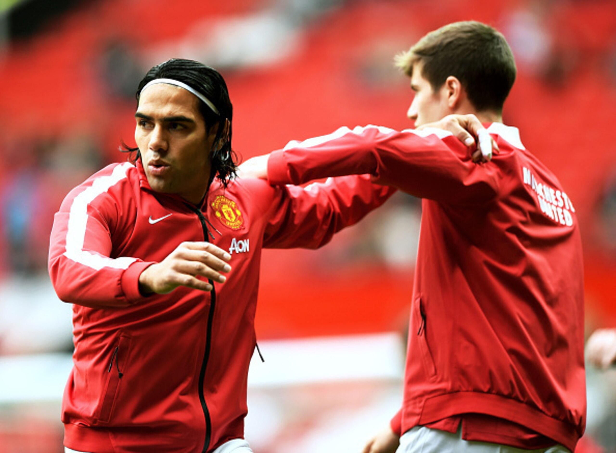 Paddy McNair warms up with Radamel Falcao