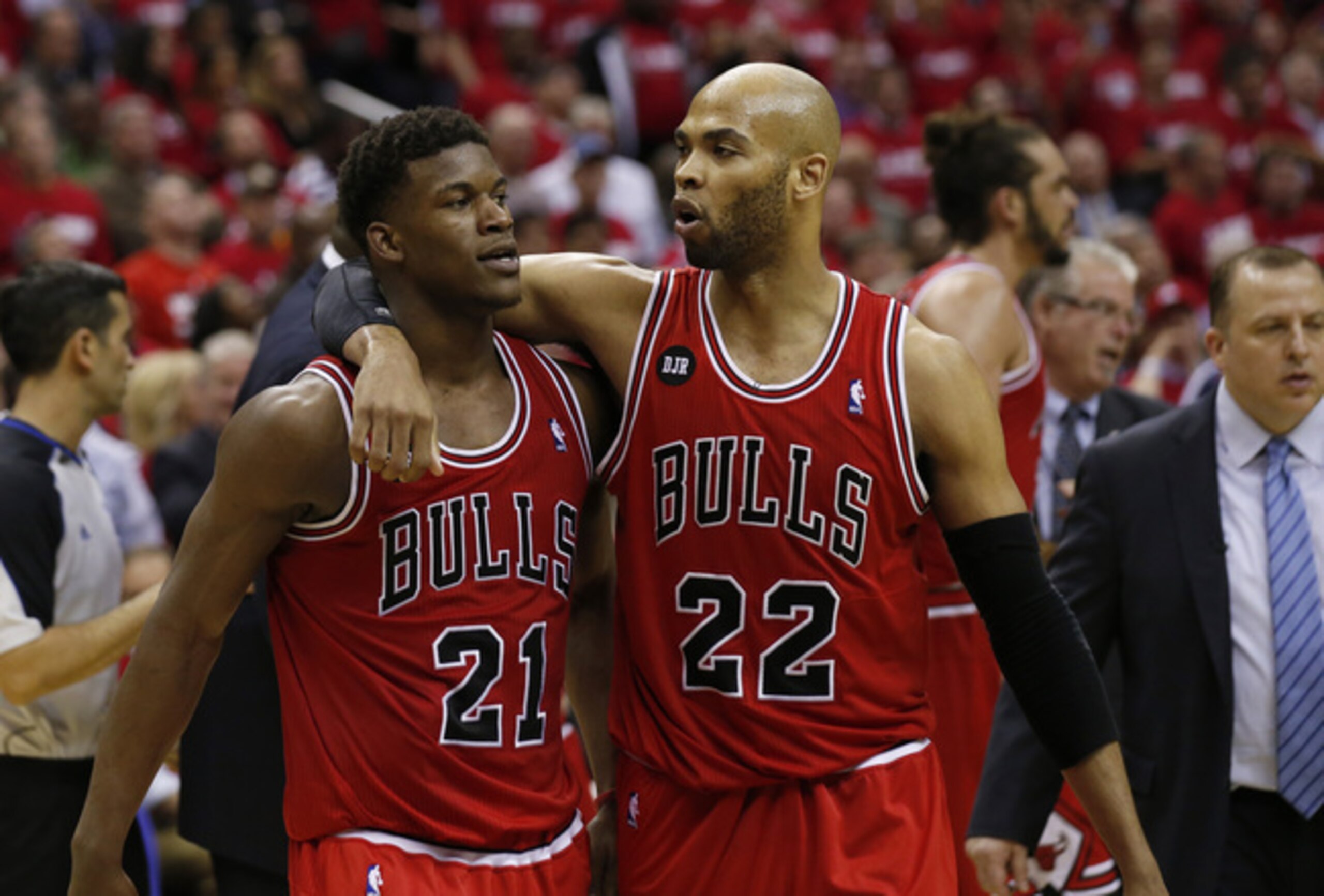 Jimmy Butler (right) and Taj Gibson (left) conference on the court. Jimmy Butler (right) and Taj Gibson (left) conference on the court.