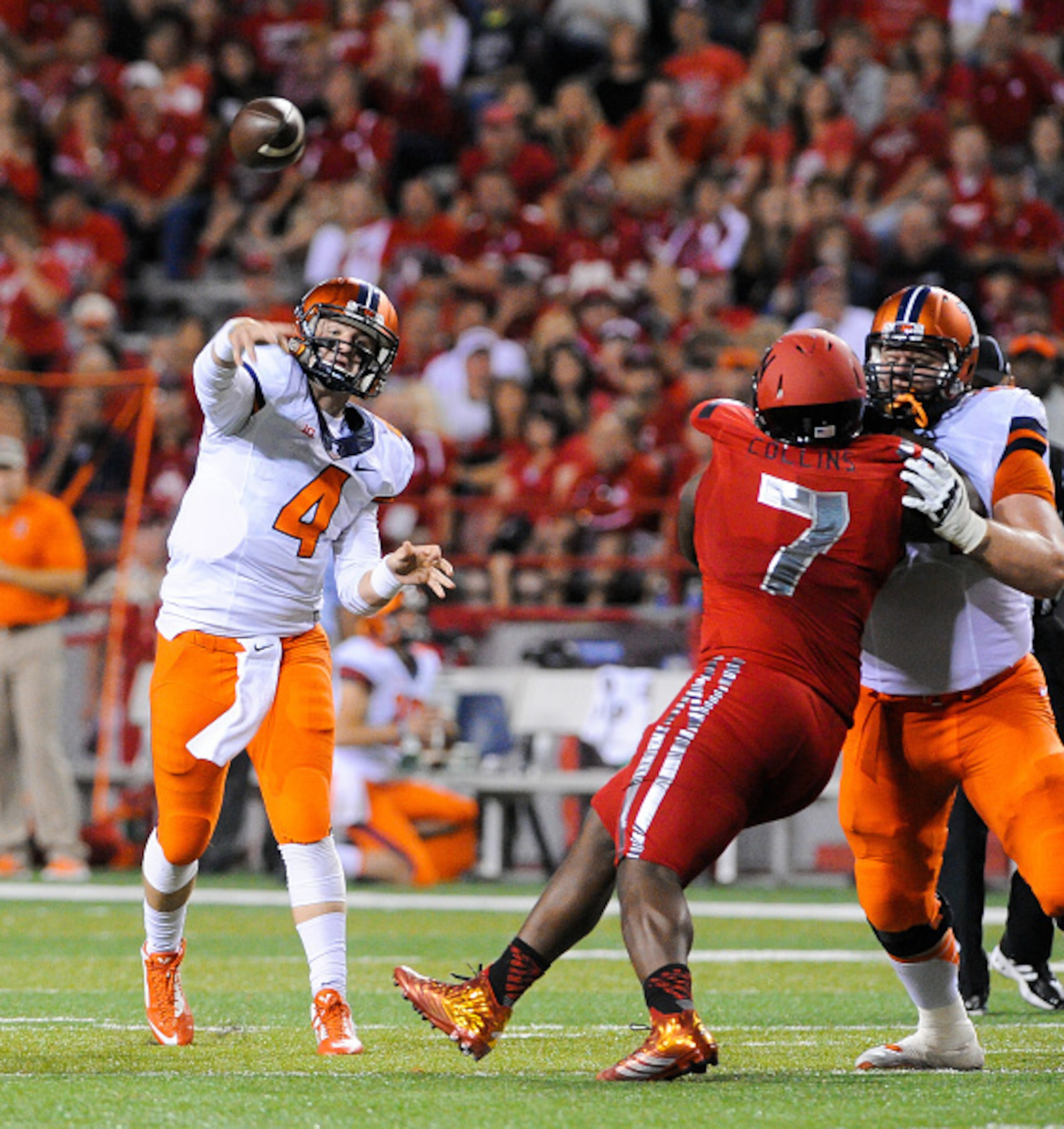 LINCOLN, NE - SEPTEMPER 27: Quarterback Reilly O'Toole #4 of the Illinois Fighting Illini throws over defensive tackle Maliek Collins #7 of the Nebraska Cornhuskers during their game at Memorial Stadium on September 27, 2014 in Lincoln, Nebraska.  (Photo 