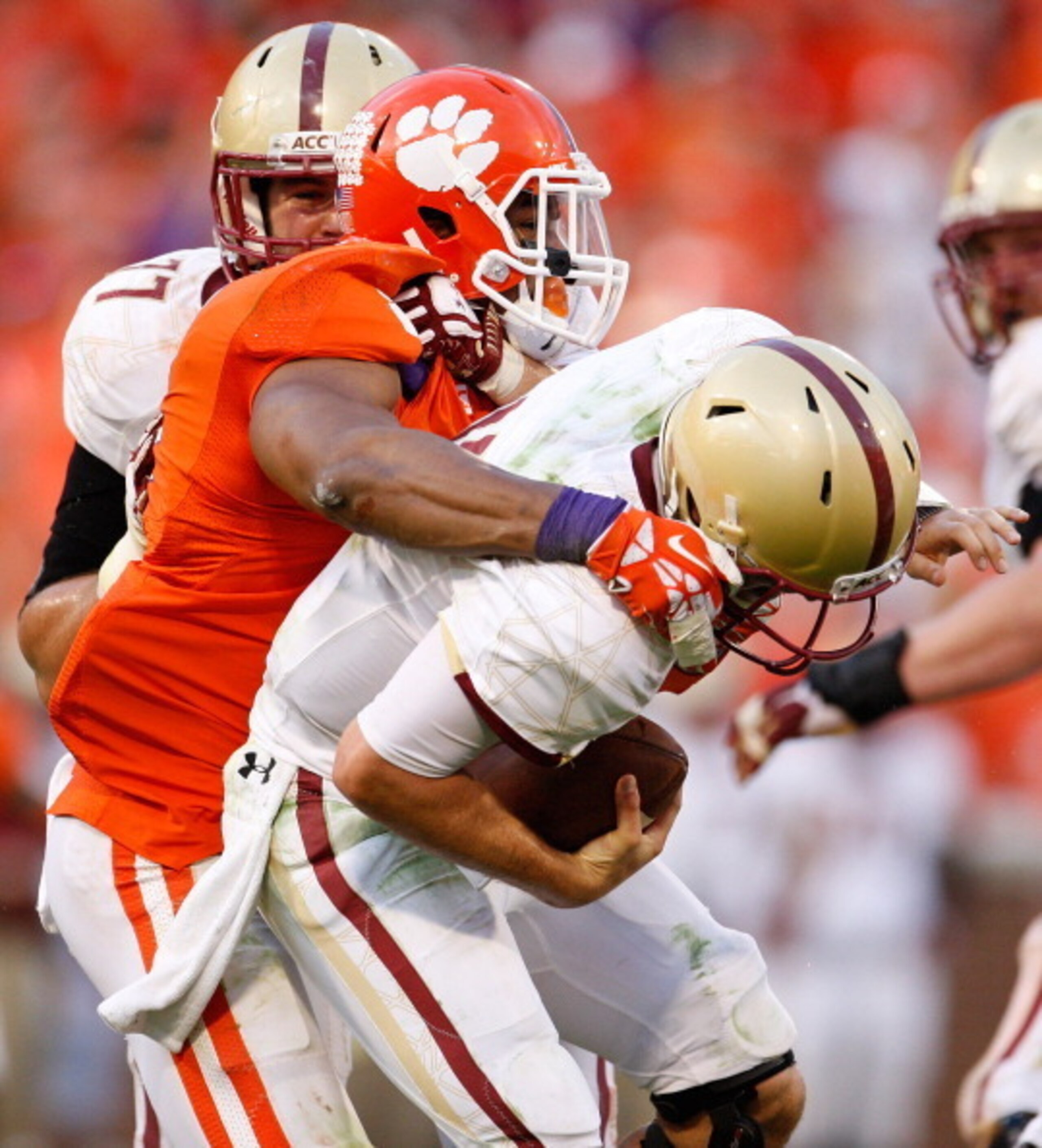 CLEMSON, SC - OCTOBER 12: Chase Rettig #11 of the Boston College Eagles is sacked by Vic Beasley #3 of the Clemson Tigers during the game at Memorial Stadium on October 12, 2013 in Clemson, South Carolina. (Photo by Tyler Smith/Getty Images)