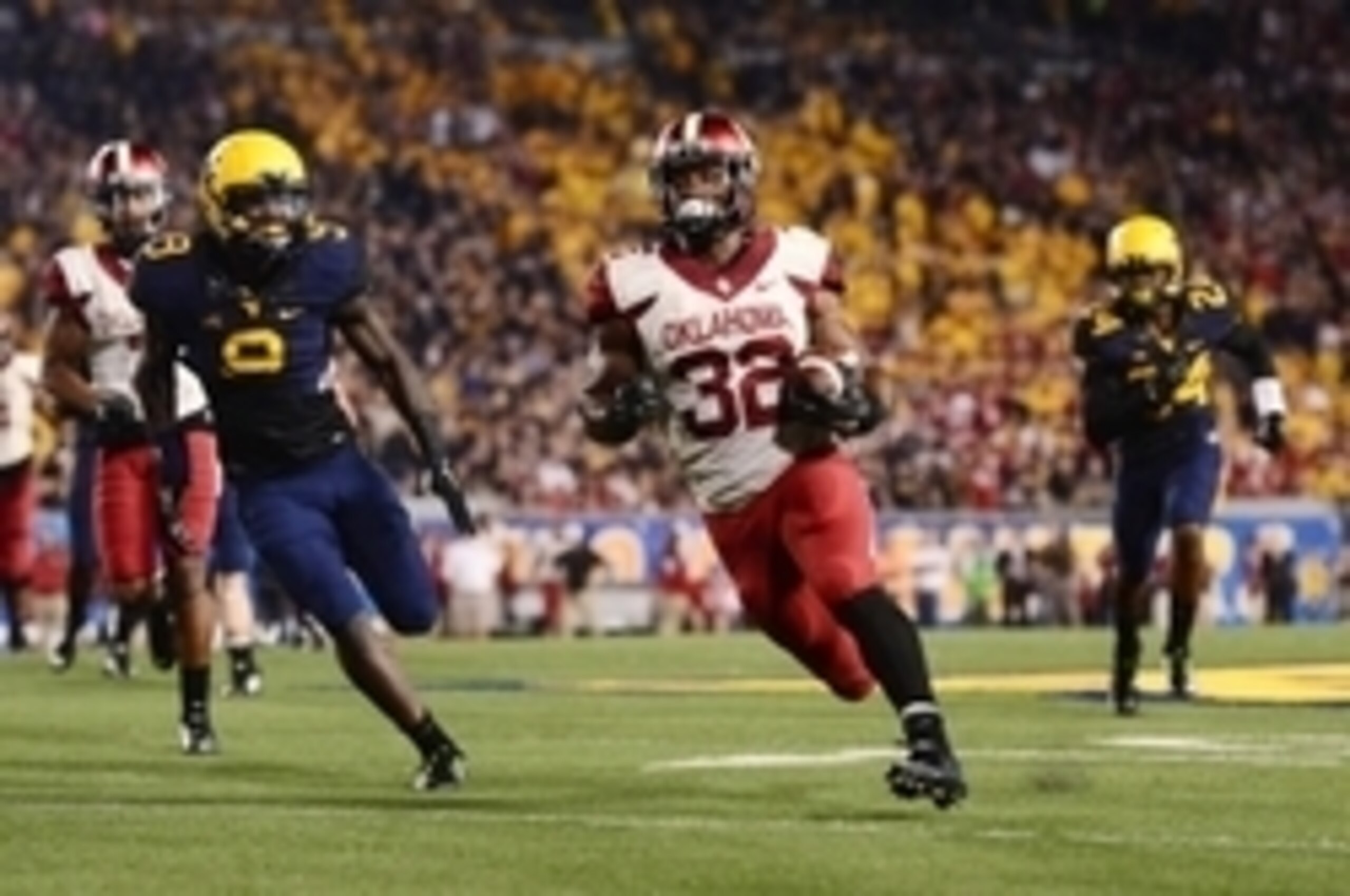 Sep 20, 2014; Morgantown, WV, USA; Oklahoma Sooners running back Samaje Perine (32) runs the ball during the fourth quarter against the West Virginia Mountaineers at Milan Puskar Stadium. Mandatory Credit: Andrew Weber-USA TODAY Sports