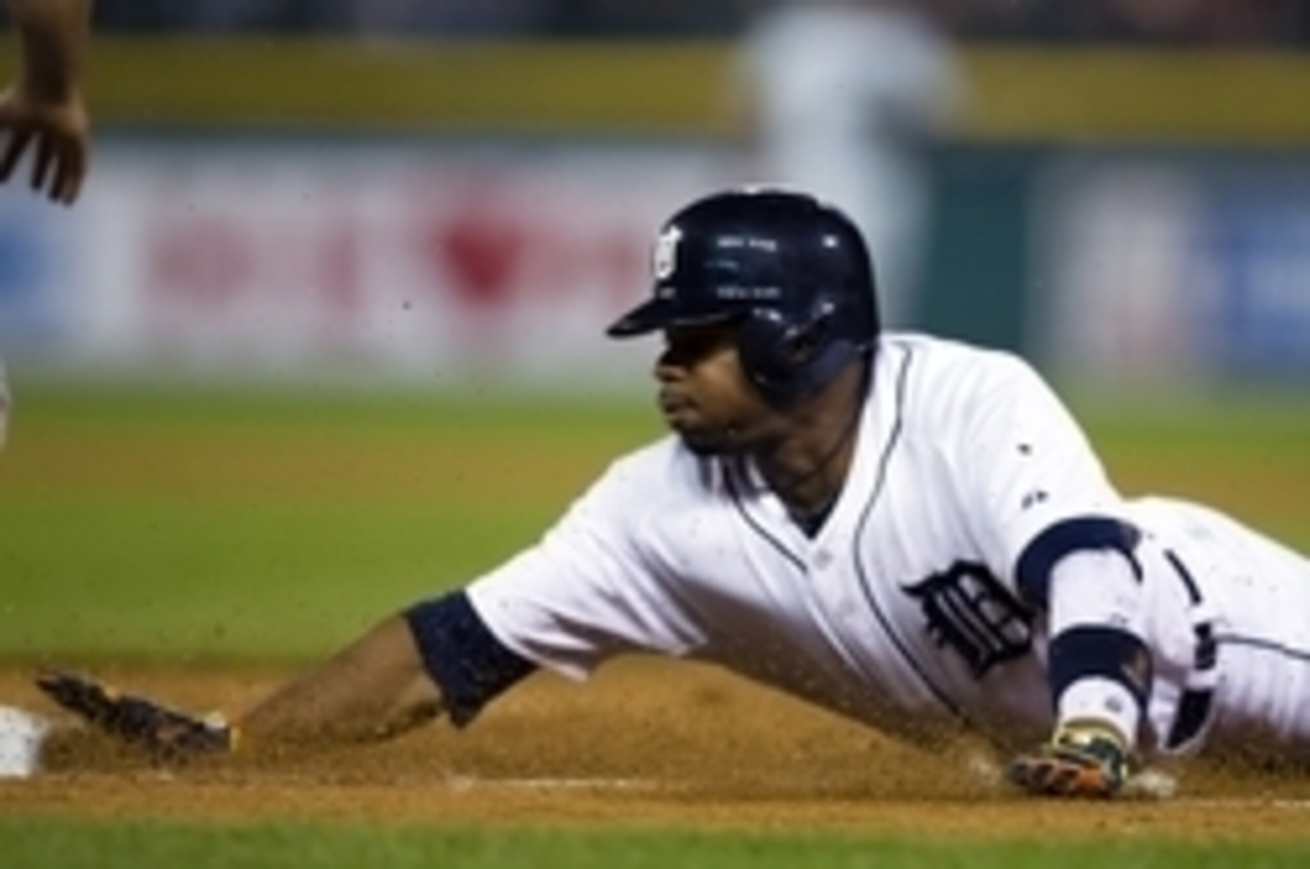 Rajai Davis steals a base for the Tigers.
