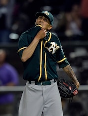 CHICAGO, IL - SEPTEMBER 8:  Relief pitcher Jesse Chavez #60 of the Oakland Athletics reacts after giving up a game-winning, solo home run to Tyler Flowers #21 of the Chicago White Sox during the twelfth inning at U.S. Cellular Field on September 8, 2014 i