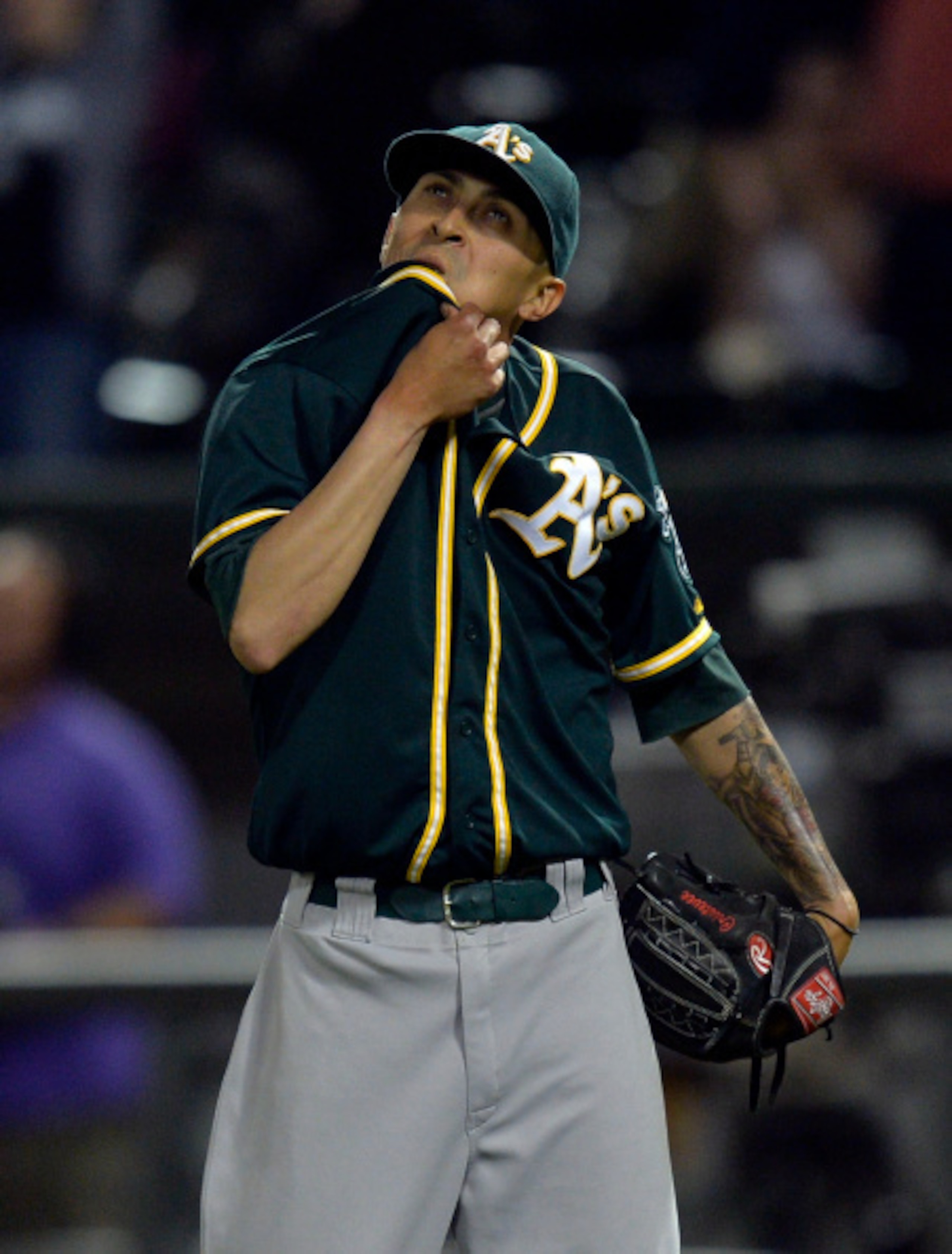 CHICAGO, IL - SEPTEMBER 8:  Relief pitcher Jesse Chavez #60 of the Oakland Athletics reacts after giving up a game-winning, solo home run to Tyler Flowers #21 of the Chicago White Sox during the twelfth inning at U.S. Cellular Field on September 8, 2014 i