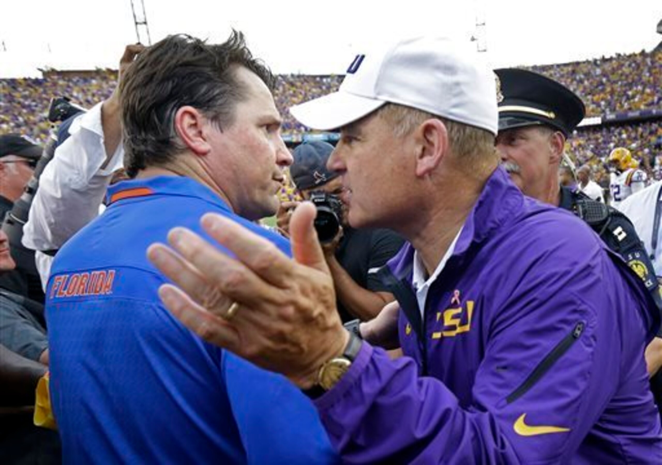 Florida head coach Will Muschamp (left) and LSU head coach Les Miles (right)