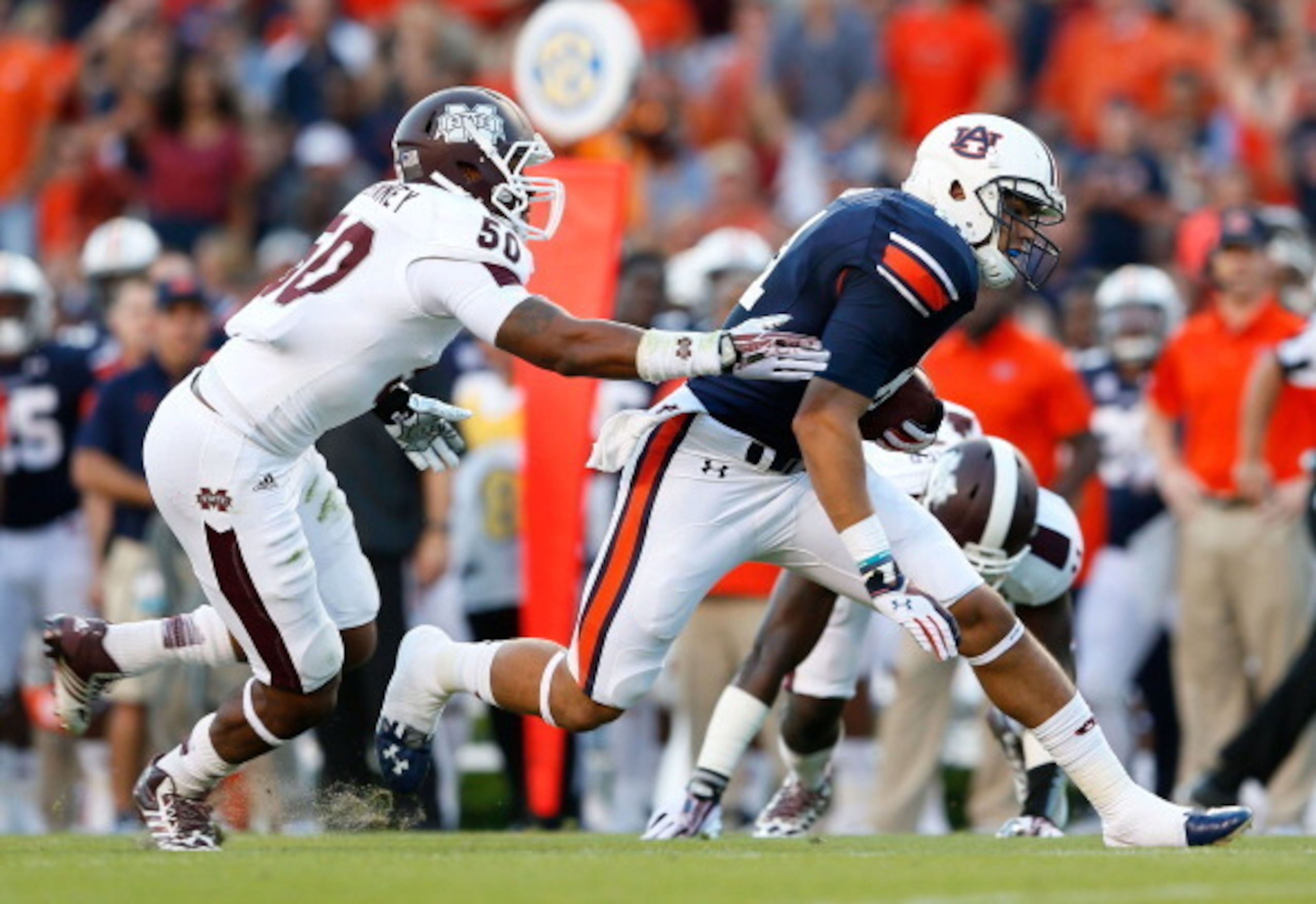 AUBURN, AL - SEPTEMBER 14: C.J. Uzomah #81 of the Auburn Tigers pulls in a reception against Benardrick McKinney #50 of the Mississippi State Bulldogs at Jordan-Hare Stadium on September 14, 2013 in Auburn, Alabama. (Photo by Kevin C. Cox/Getty Images) AUBURN, AL - SEPTEMBER 14: C.J. Uzomah #81 of the Auburn Tigers pulls in a reception against Benardrick McKinney #50 of the Mississippi State Bulldogs at Jordan-Hare Stadium on September 14, 2013 in Auburn, Alabama. (Photo by Kevin C. Cox/Getty Images)