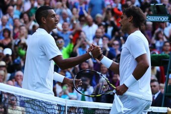 Nick Kyrgios and Rafael Nadal shake hands after their Wimbledon match.