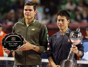Milos Raonic and Kei Nishikori pose for pictures during the trophy ceremony at the 2014 Japan Open.
