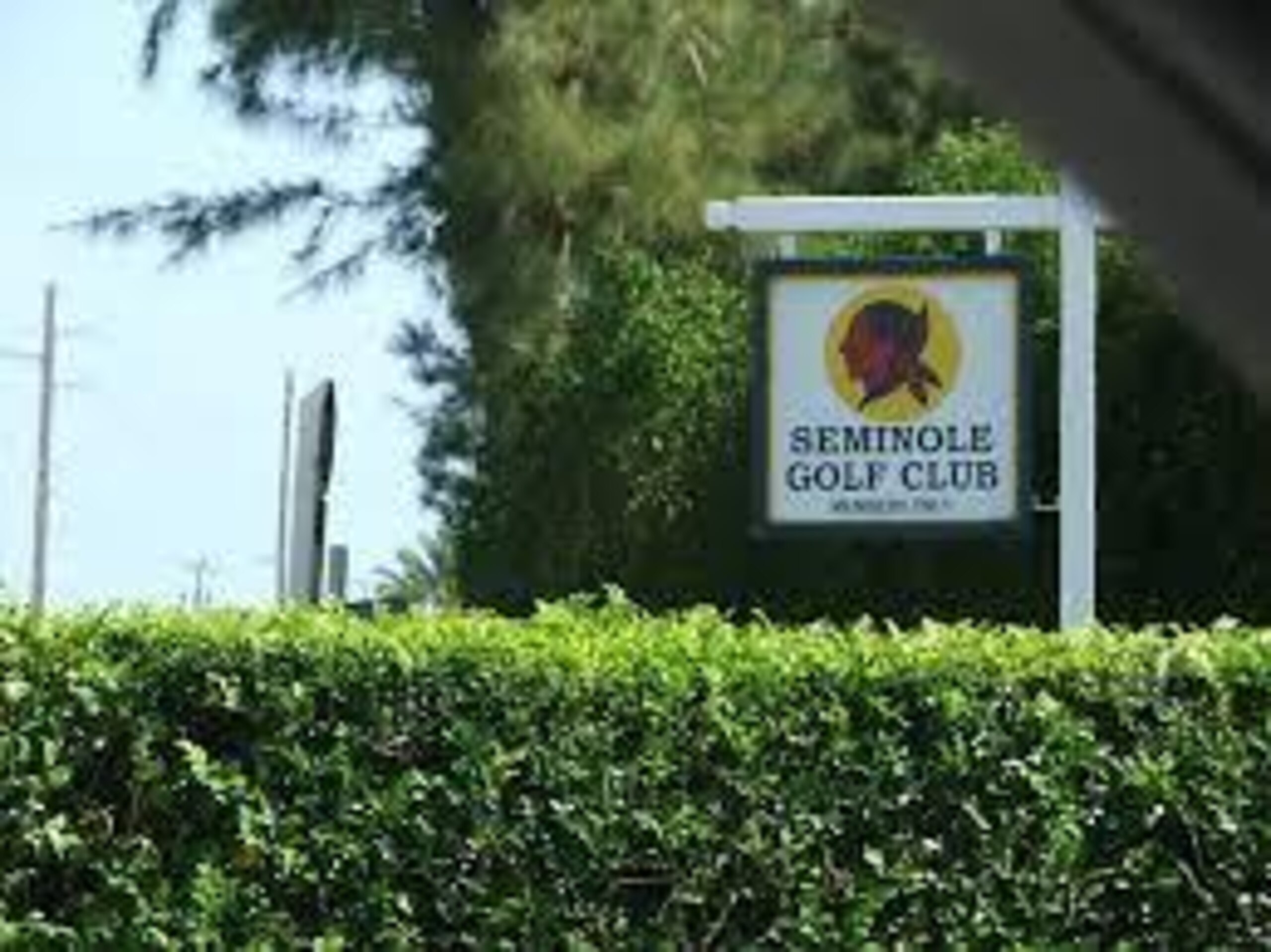 Seminole Golf Club's modest sign at its entrance.