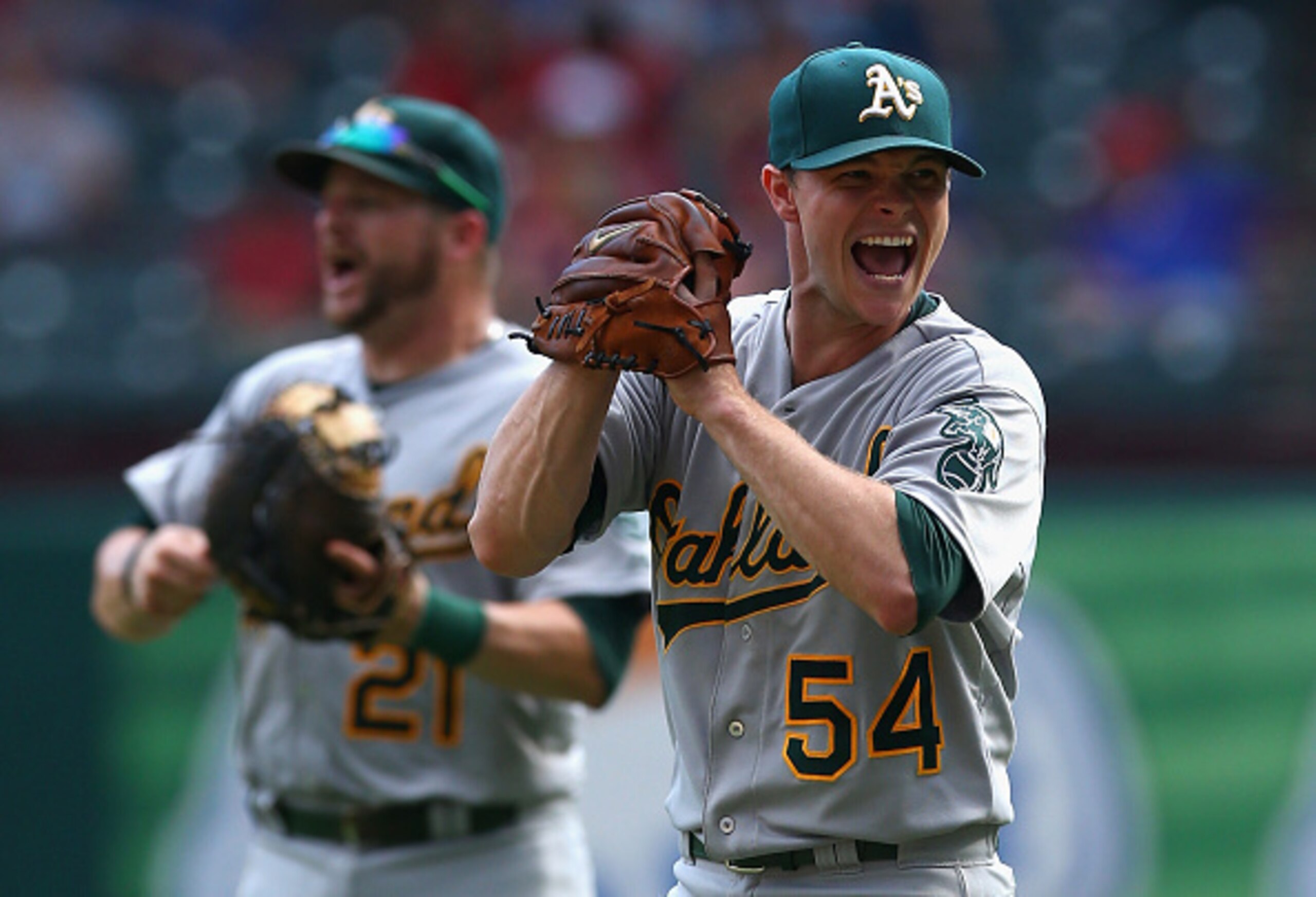 Sonny Gray celebrates with smiles after clinching a postseason berth for the A's. Sonny Gray celebrates with smiles after clinching a postseason berth for the A's.