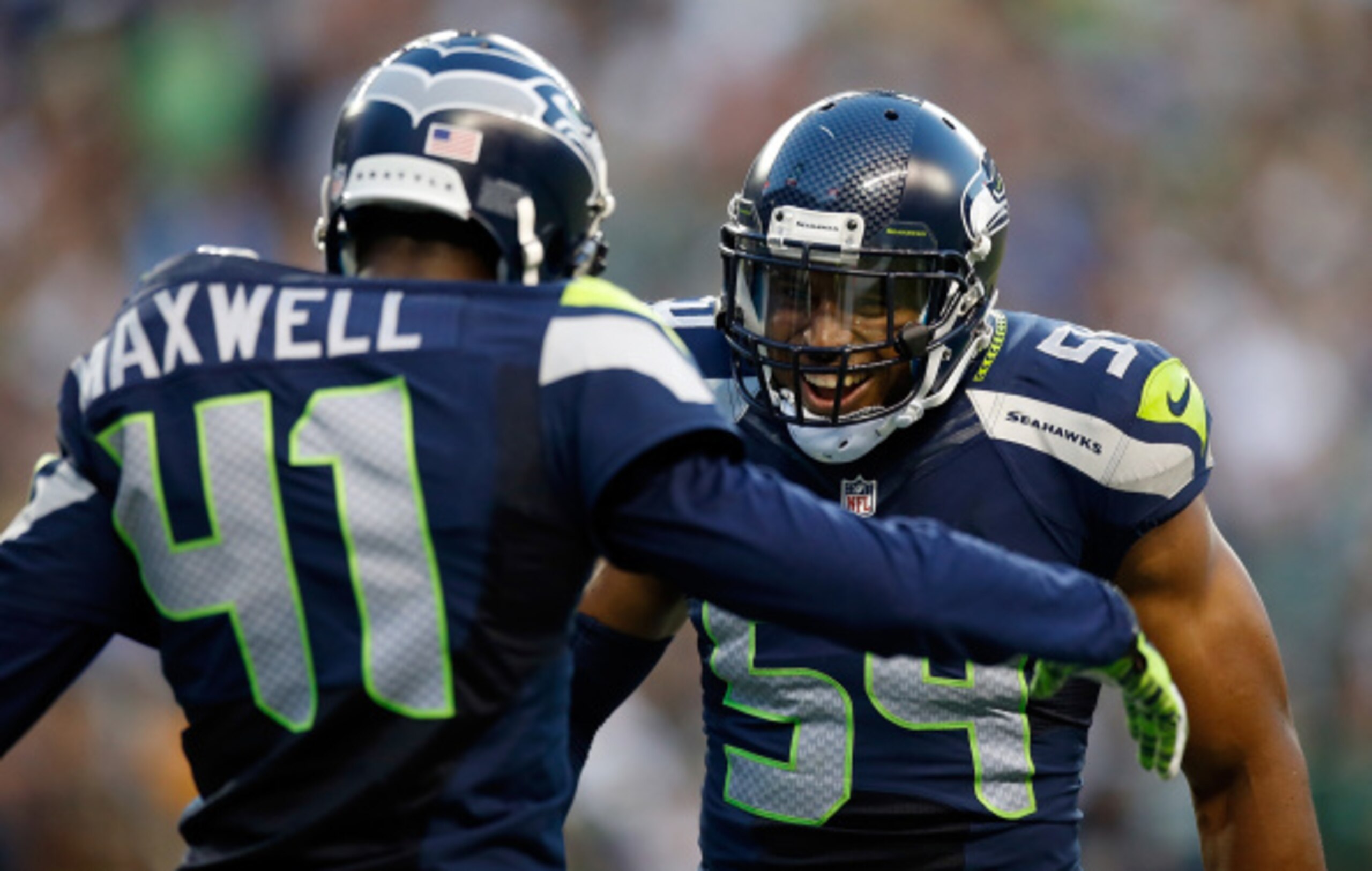 SEATTLE, WA - SEPTEMBER 04:  Cornerback Byron Maxwell #41 and linebacker Bobby Wagner #54 of the Seattle Seahawks celebrate after Maxwell intercepted a pass during the third quarter of the game against the Green Bay Packers at CenturyLink Field on Septemb