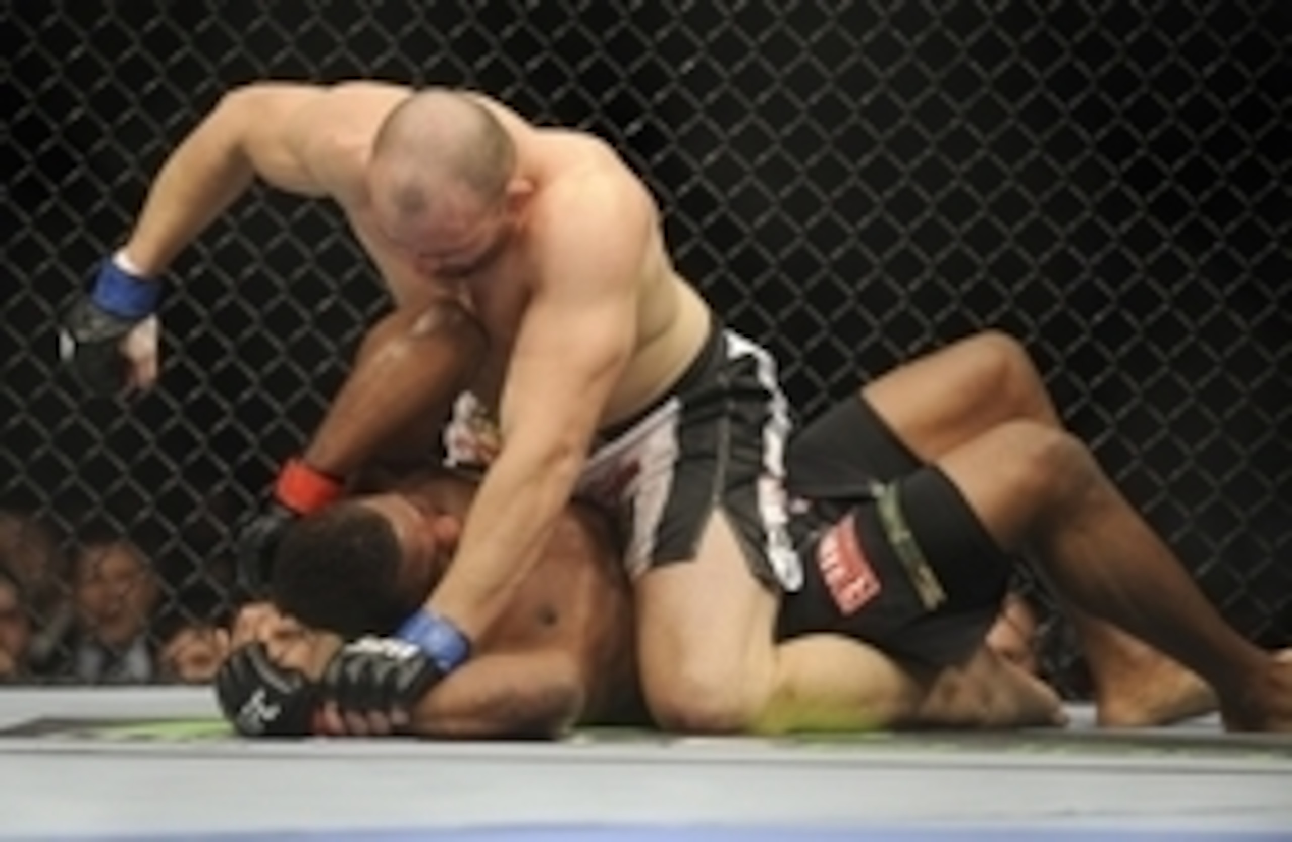 Jan 26, 2013; Chicago, IL, USA; Rampage Jackson (black shorts) fights against Glover Teixeira (black and white shorts) during UFC on FOX 6 at the United Center. Mandatory Credit: David Banks-USA TODAY Sports Jan 26, 2013; Chicago, IL, USA; Rampage Jackson (black shorts) fights against Glover Teixeira (black and white shorts) during UFC on FOX 6 at the United Center. Mandatory Credit: David Banks-USA TODAY Sports