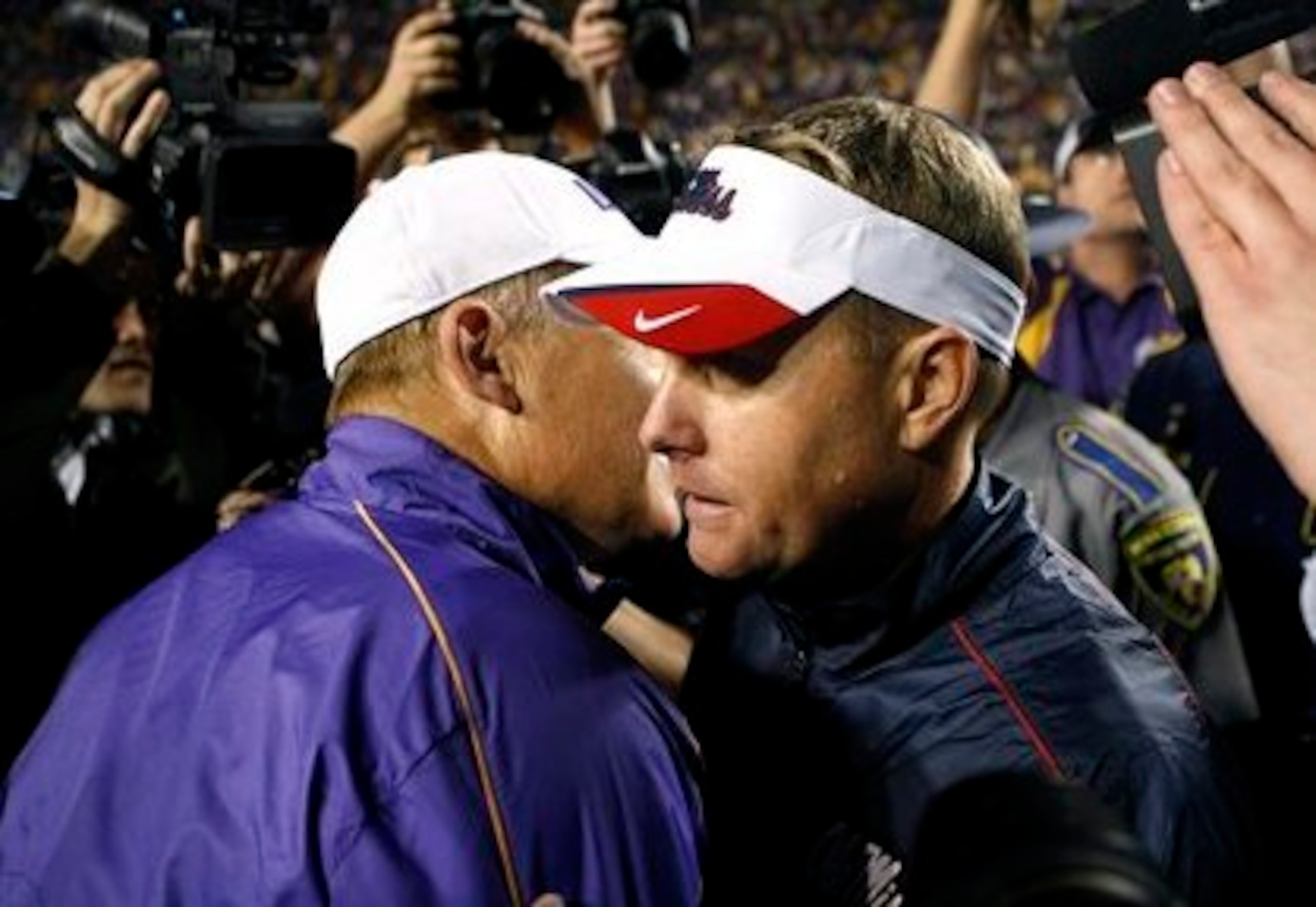 LSU head coach Les Miles (left) and Hugh Freeze (right)