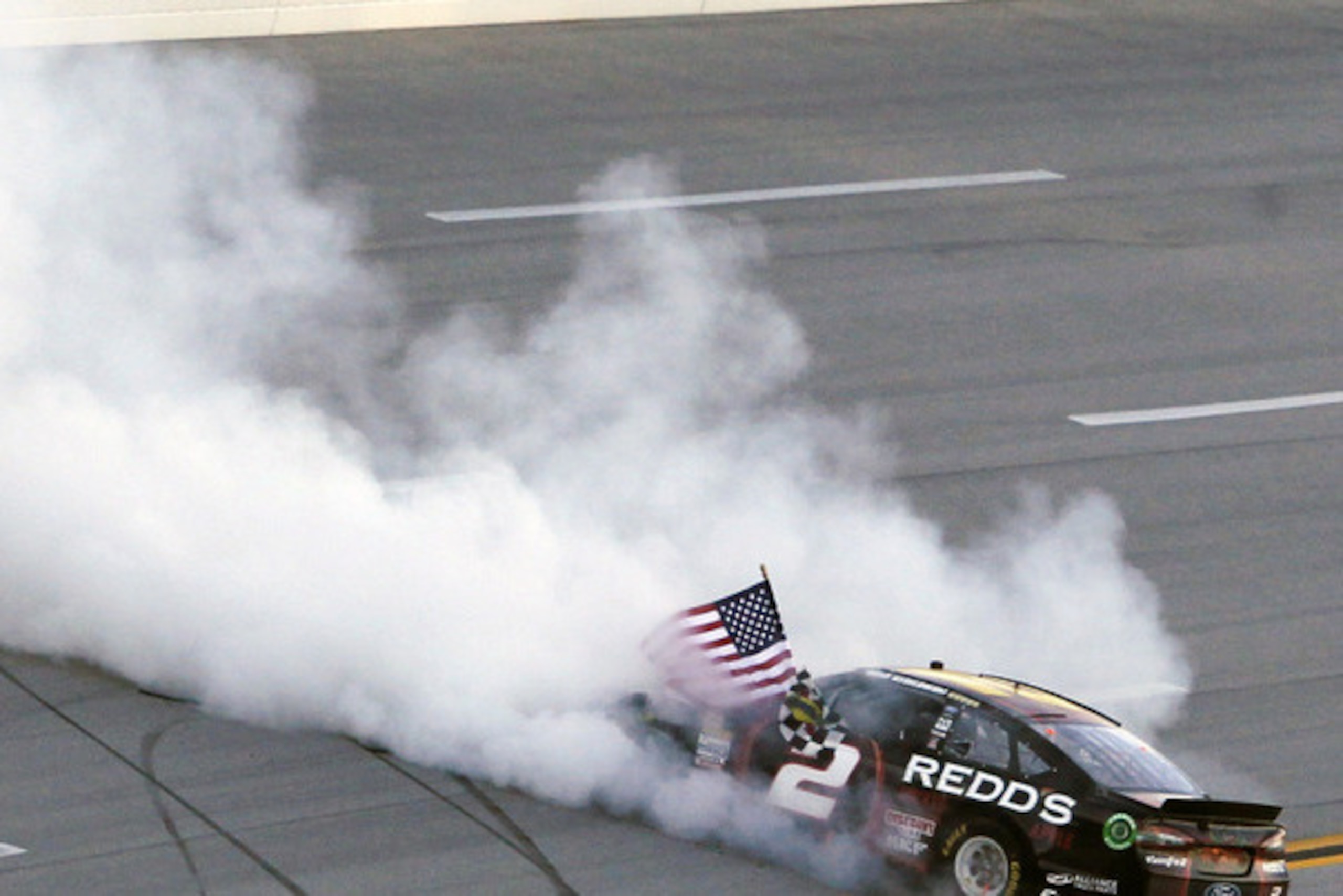 Brad Keselowski celebrates his Geico 500 win.