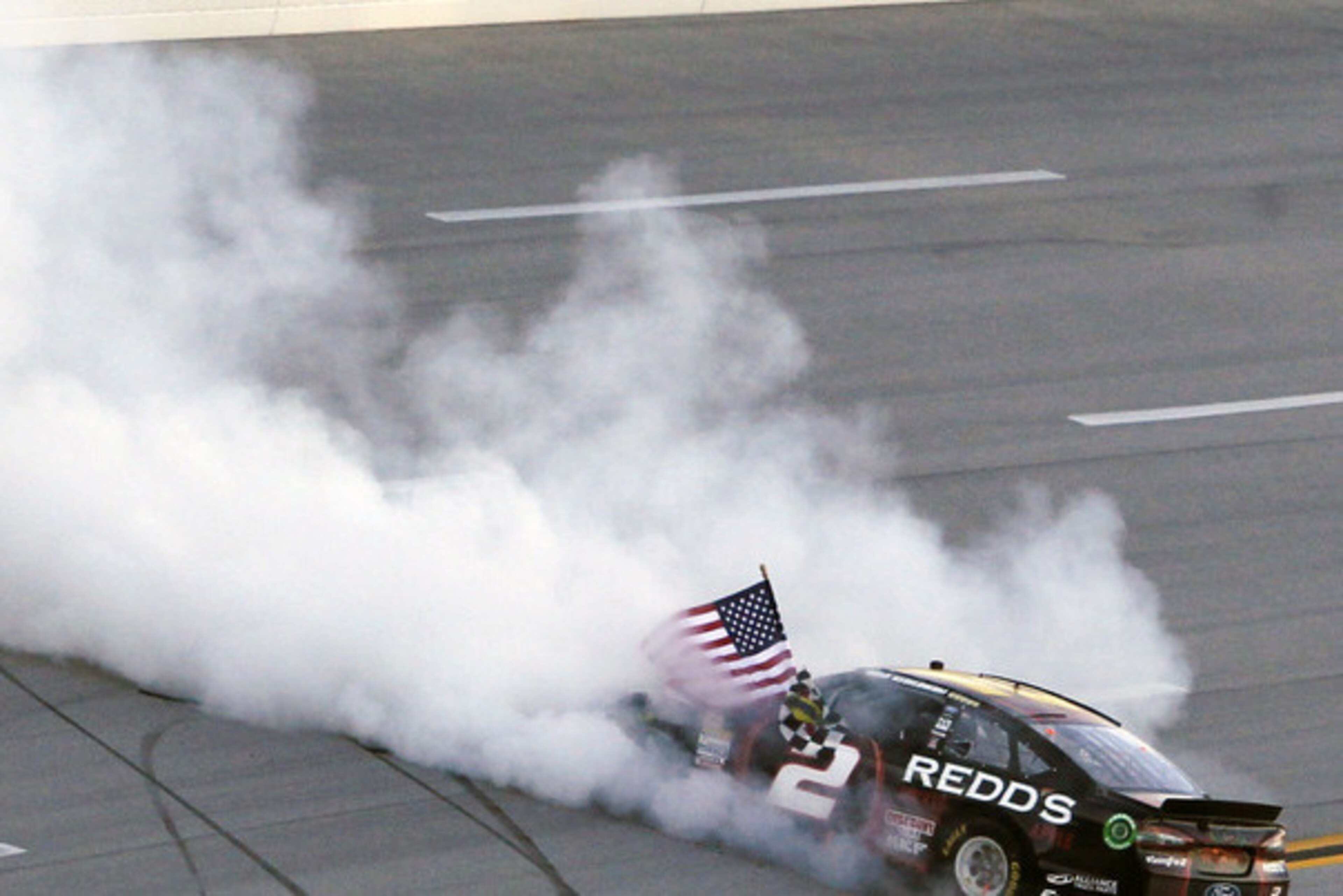Brad Keselowski celebrates his Geico 500 win.