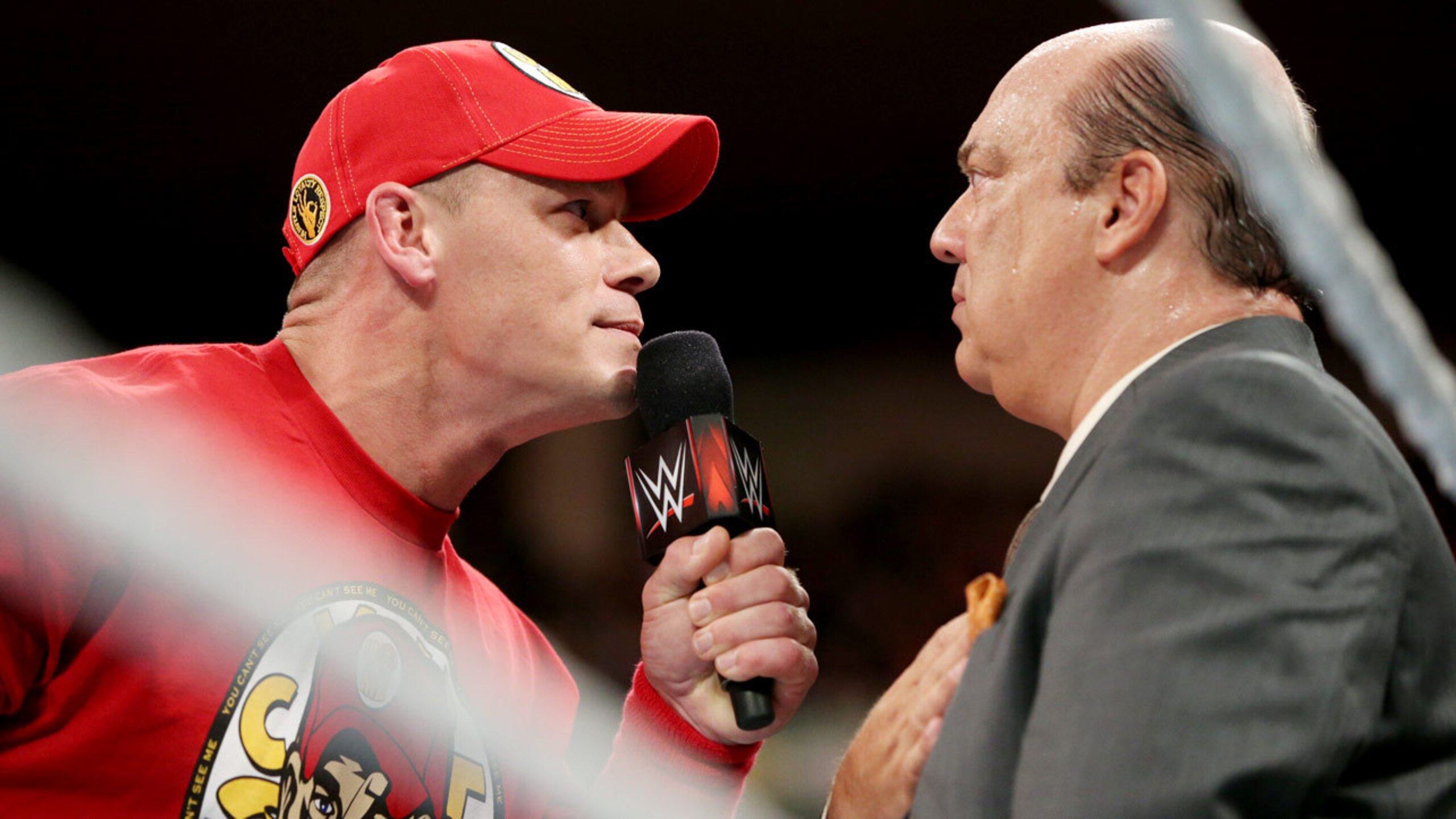 John Cena eyes Paul Heyman.