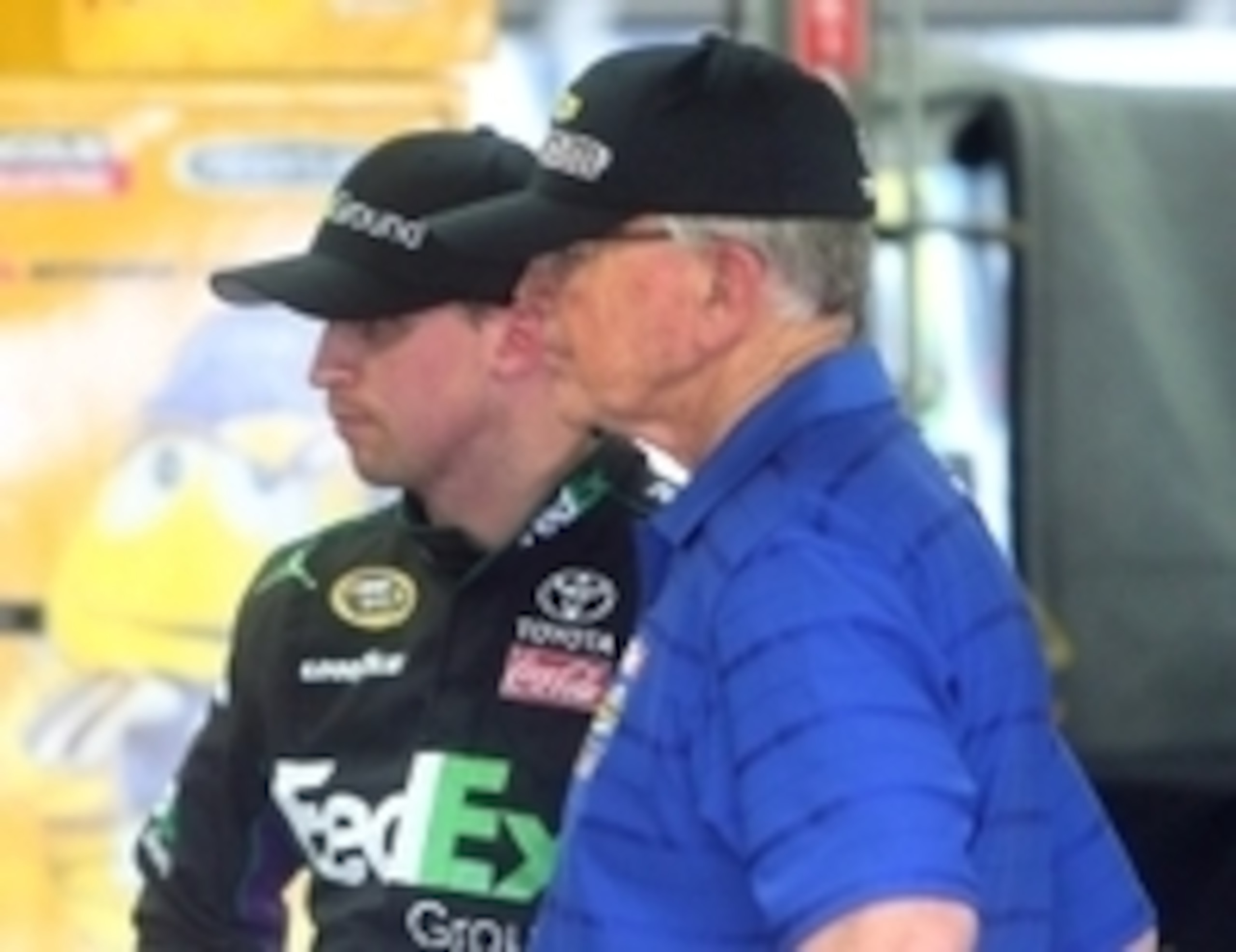Denny Hamlin (left) with team owner Coach Joe Gibbs