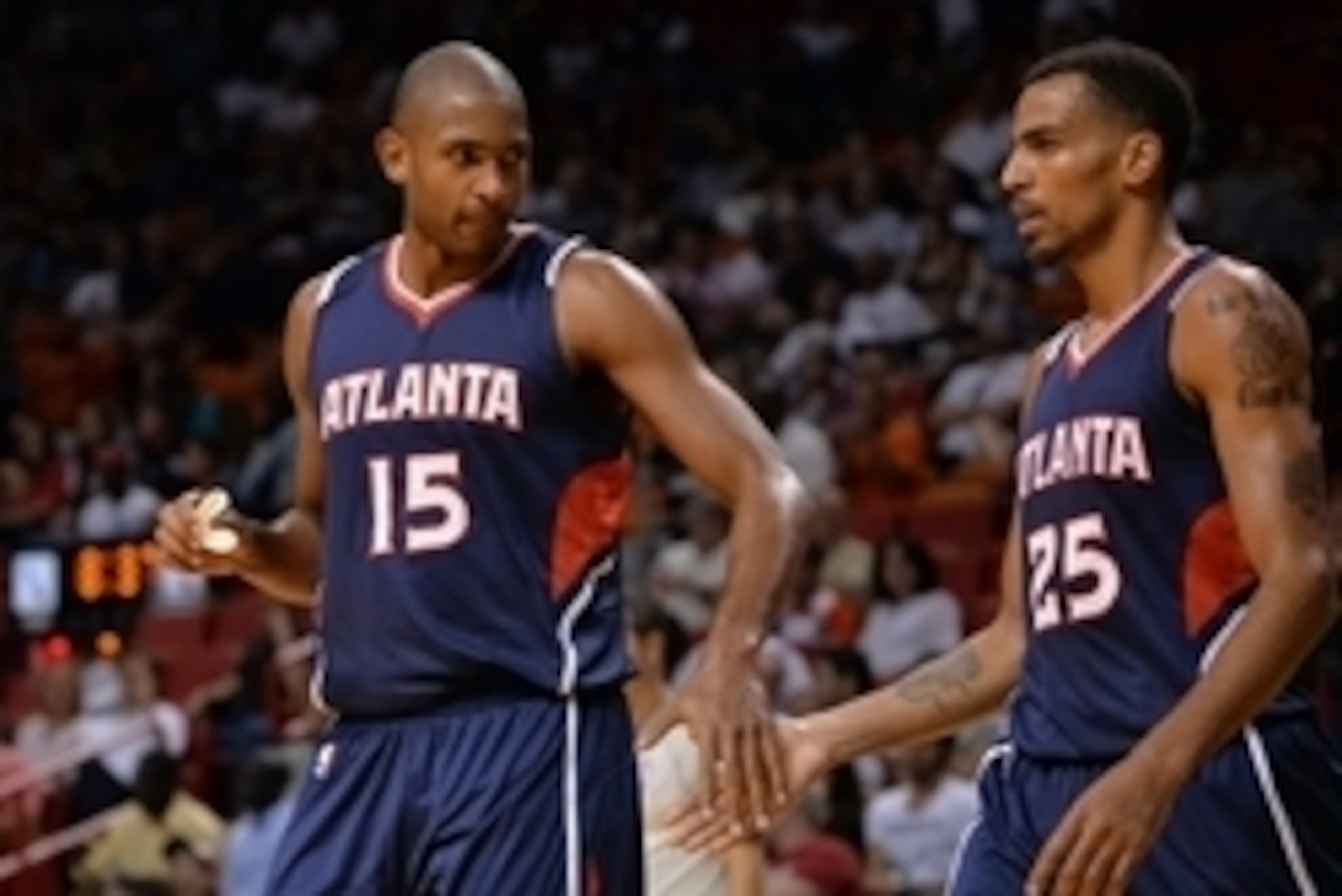 The return of Al Horford (left) and the acquisition of Thabo Sefolosha (right) will improve the Hawks' roster in 2014-15.