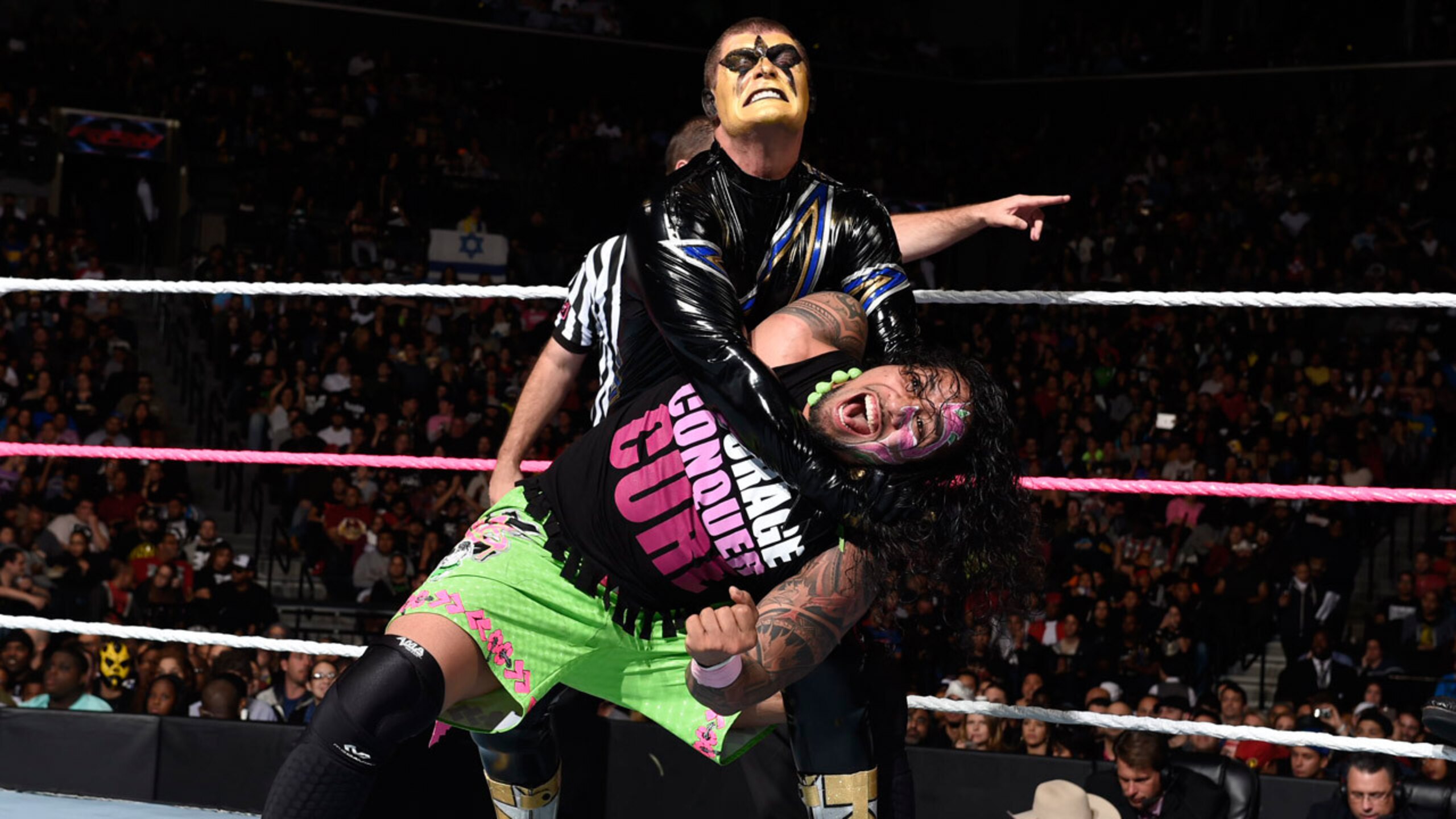 Stardust puts the stretch on Jey Uso.