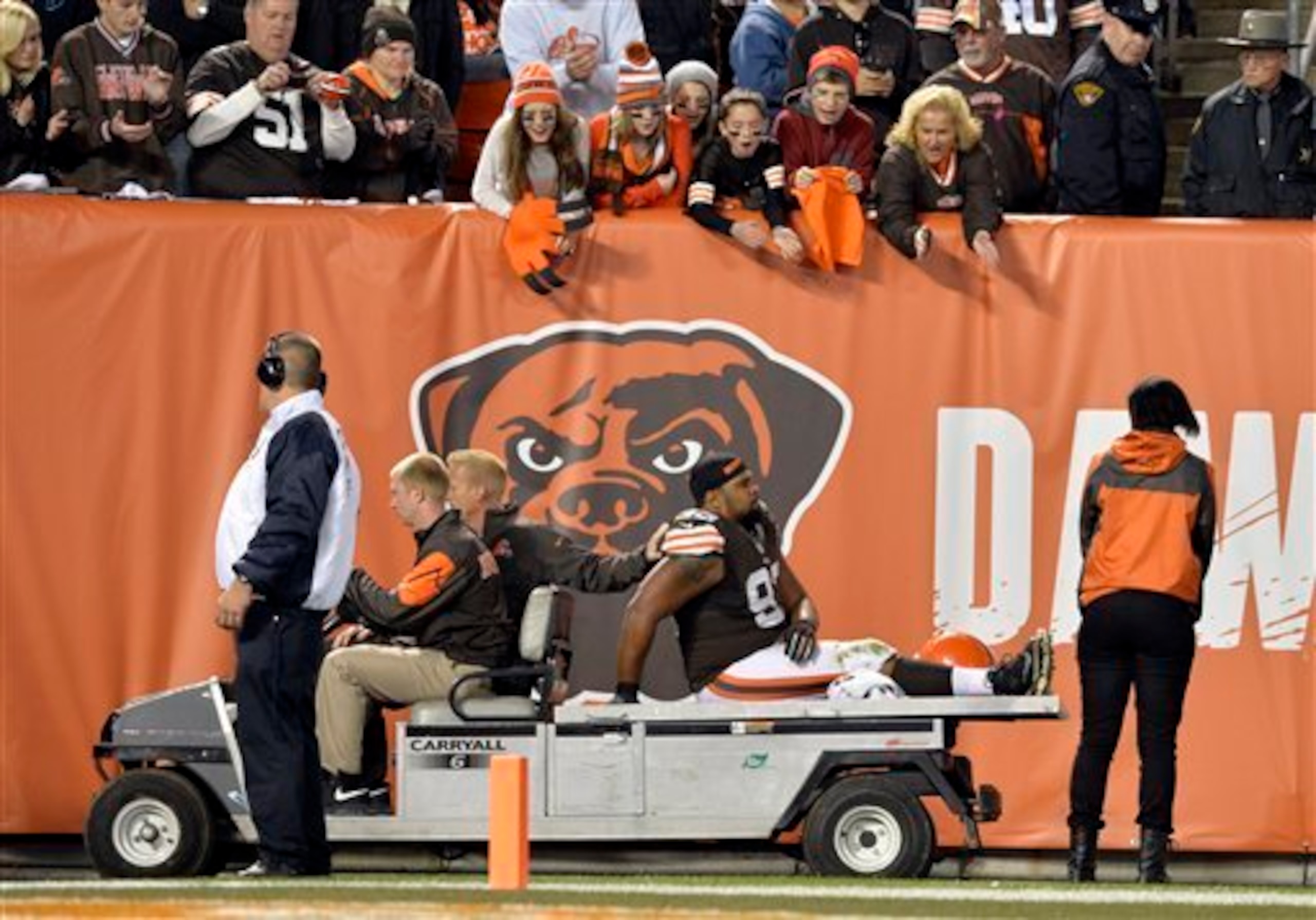 John Hughes being carted off the field.