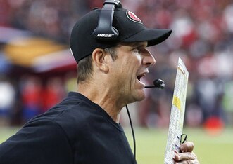 Jim Harbaugh passes the headset test.