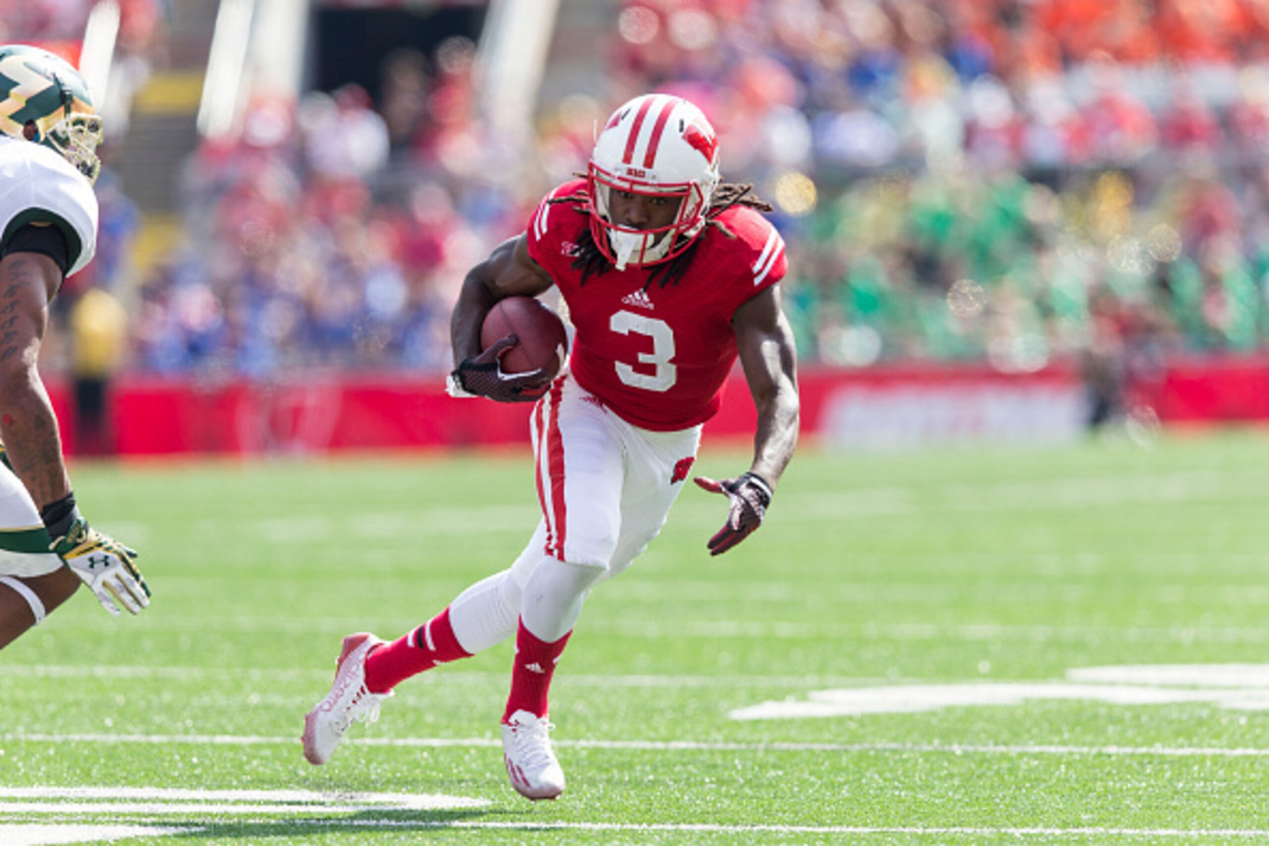 MADISON, WI - SEPTEMBER 27: Kenzel Doe #3 of the Wisconsin Badgers runs the ball against the South Florida Bulls defense on September 27, 2014 at Camp Randall Stadium in Madison, Wisconsin. (Photo by Tom Lynn/Getty Images) MADISON, WI - SEPTEMBER 27: Kenzel Doe #3 of the Wisconsin Badgers runs the ball against the South Florida Bulls defense on September 27, 2014 at Camp Randall Stadium in Madison, Wisconsin. (Photo by Tom Lynn/Getty Images)
