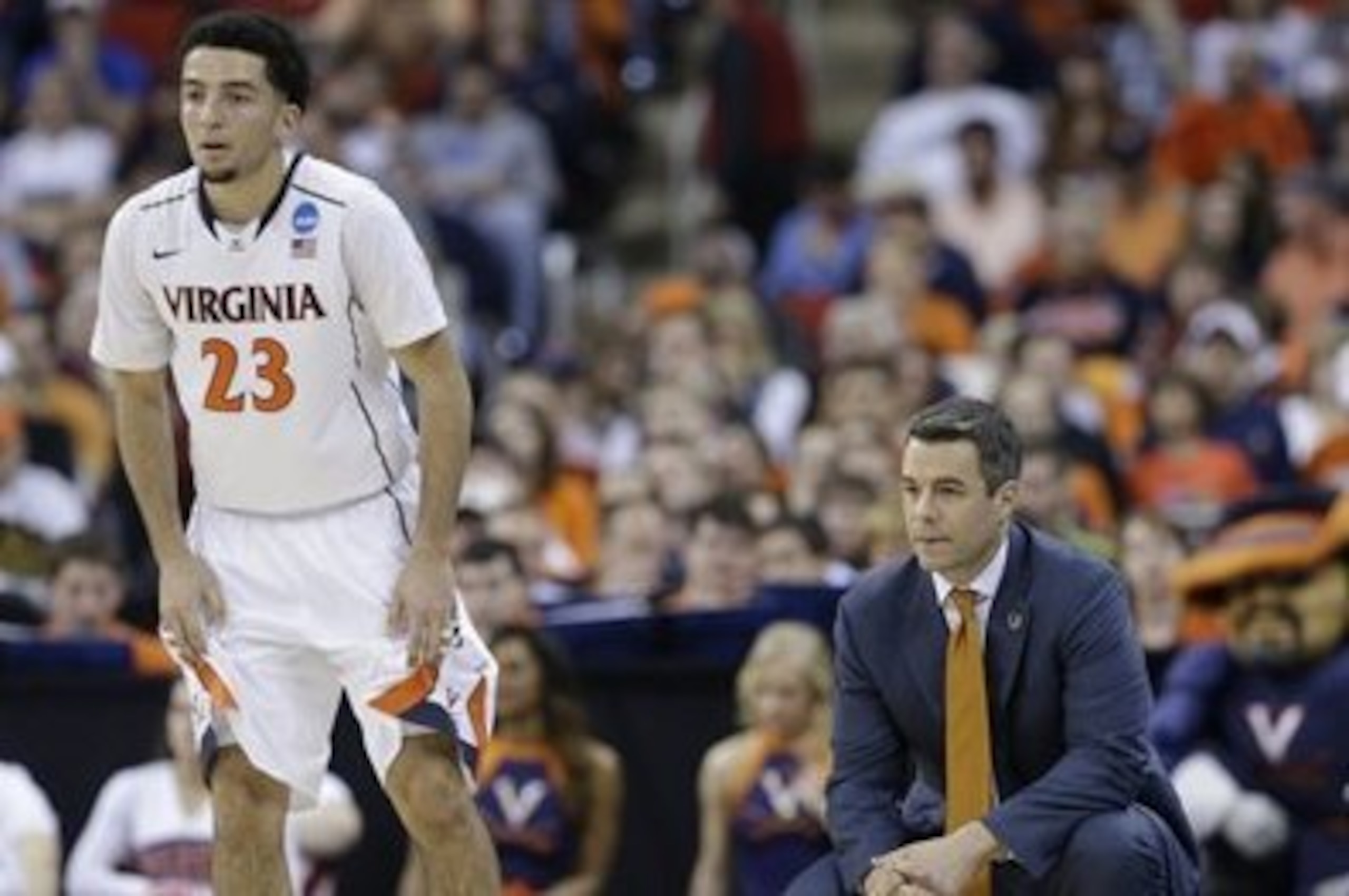Point guard London Perrantes and Tony Bennett