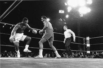 When George Foreman knocked down Joe Frazier in 1973, Howard Cosell was there to give it life.