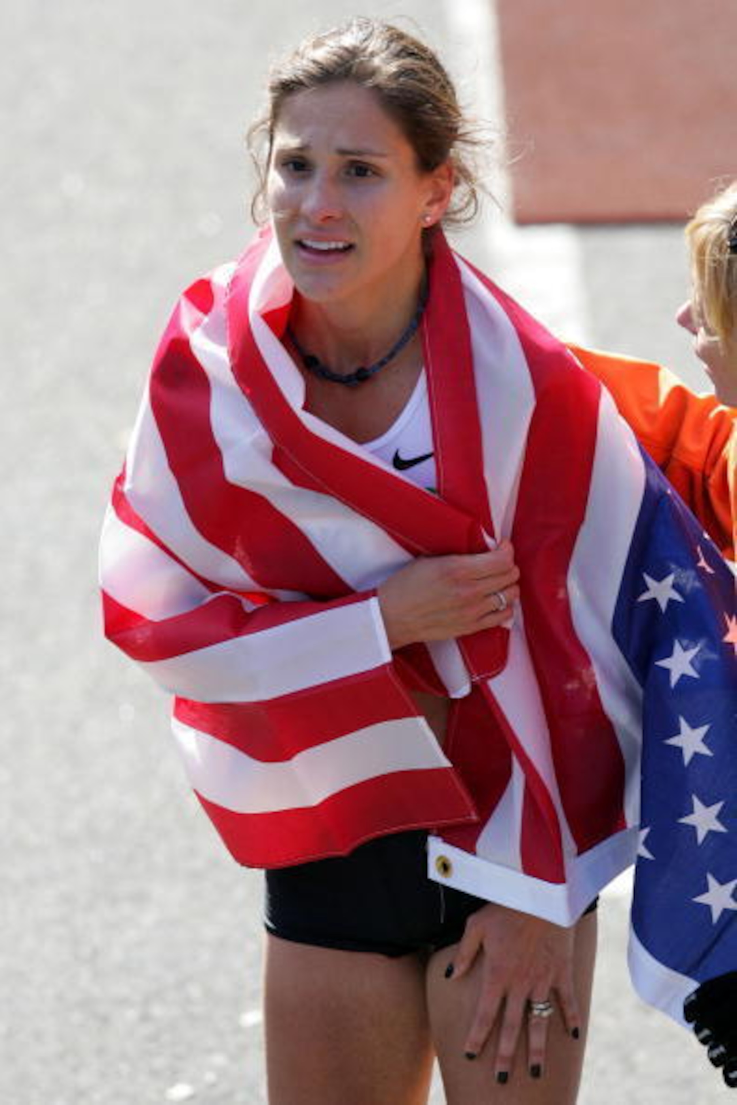 Kara Goucher wrapped with an American flag after making her 2008 debut in New York Kara Goucher wrapped with an American flag after making her 2008 debut in New York