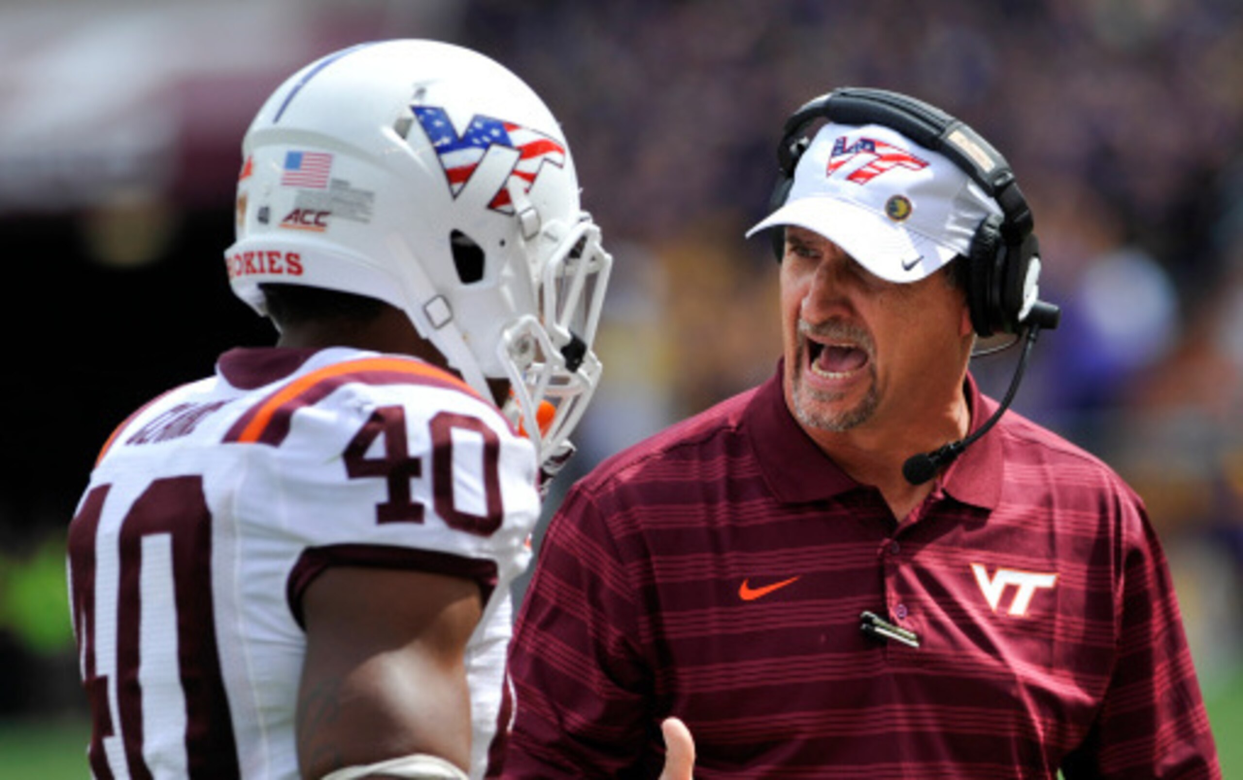 Linebacker Deon Clarke and defensive coordinator Bud Foster