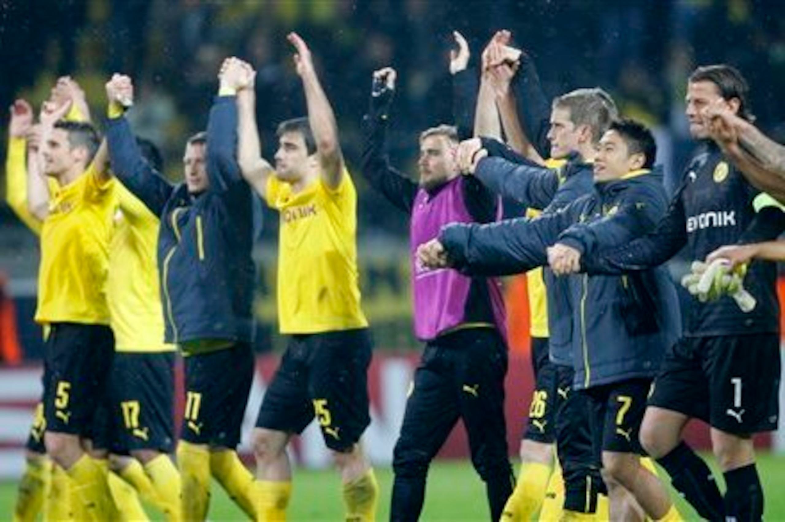 Borussia Dortmund celebrate a 4-1 win over Galatasaray and their progression into the knockout stages of the Champions League.