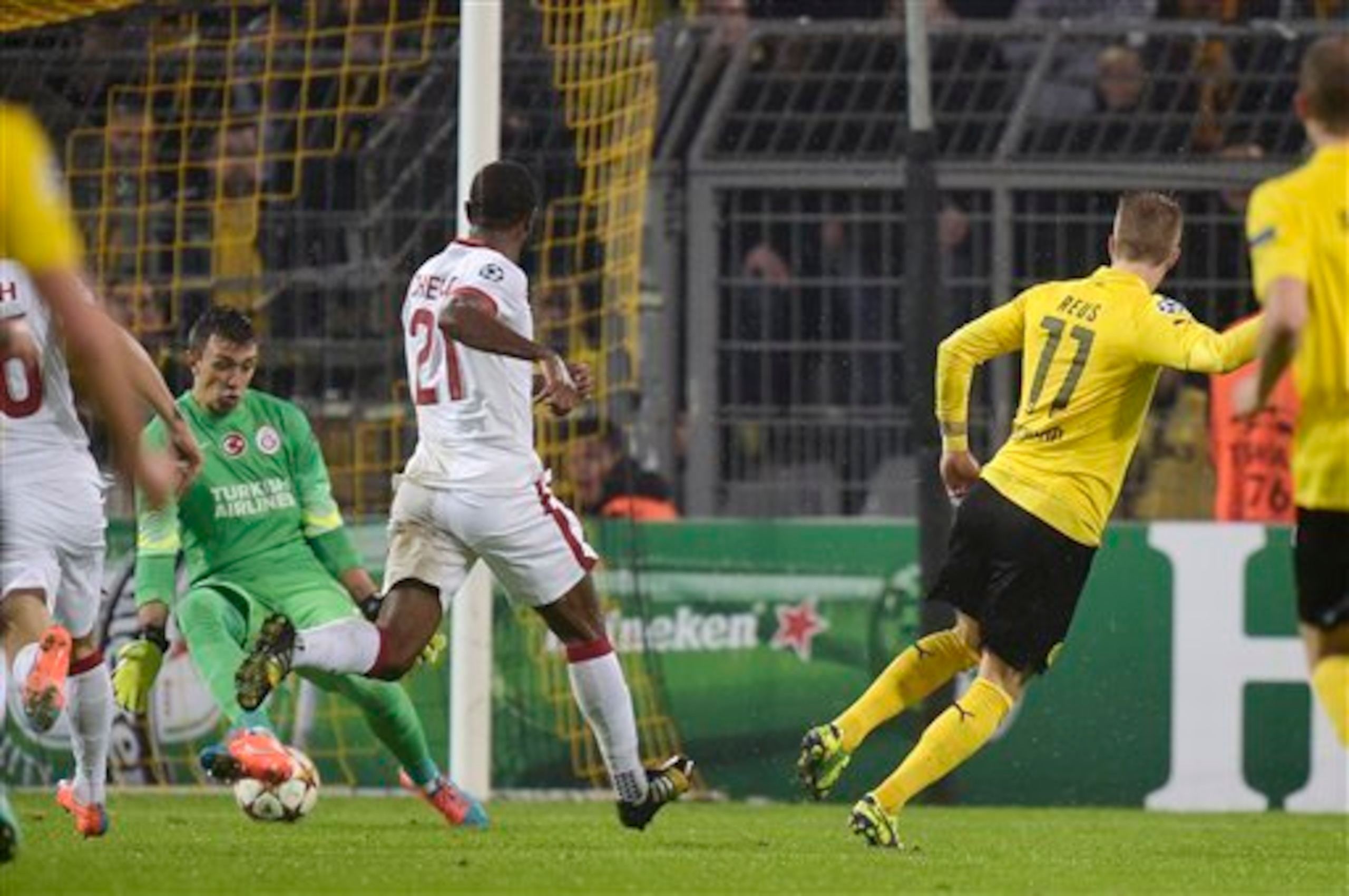 Marco Reus fires past Fernando Muslera to give Borussia Dortmund a 1-0 lead.