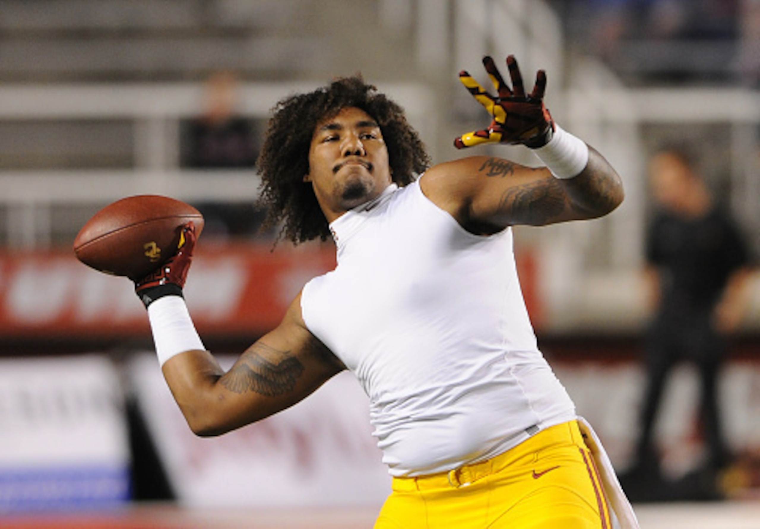 SALT LAKE CITY, UT - OCTOBER 25: Defensive end Leonard Williams #94 of the USC Trojans plays catch before their game against the Utah Utes at Rice-Eccles Stadium on October 25, 2014 in Salt Lake City, Utah. (Photo by Gene Sweeney Jr/Getty Images )