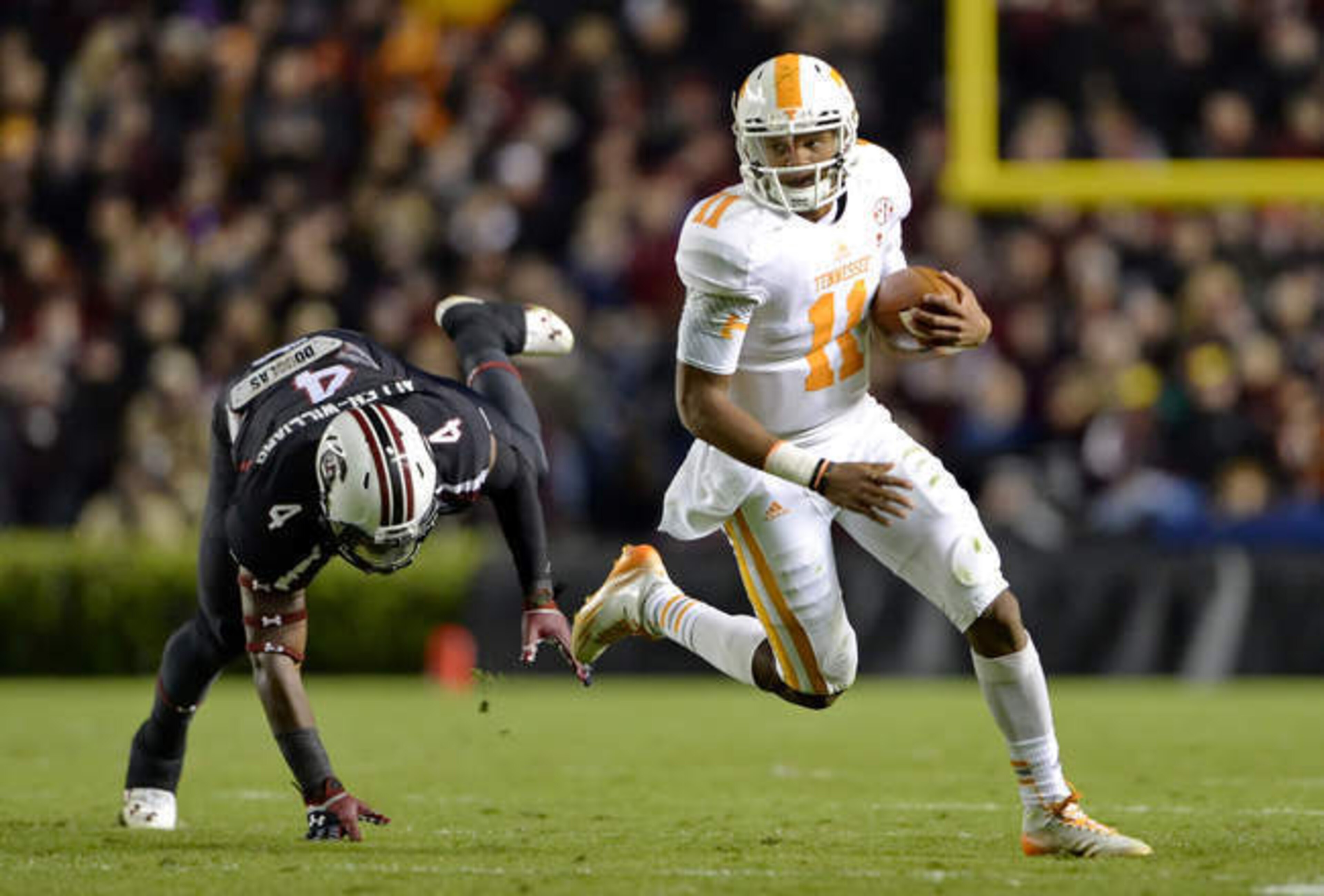The Vols discovered a playmaker in Dobbs (right).