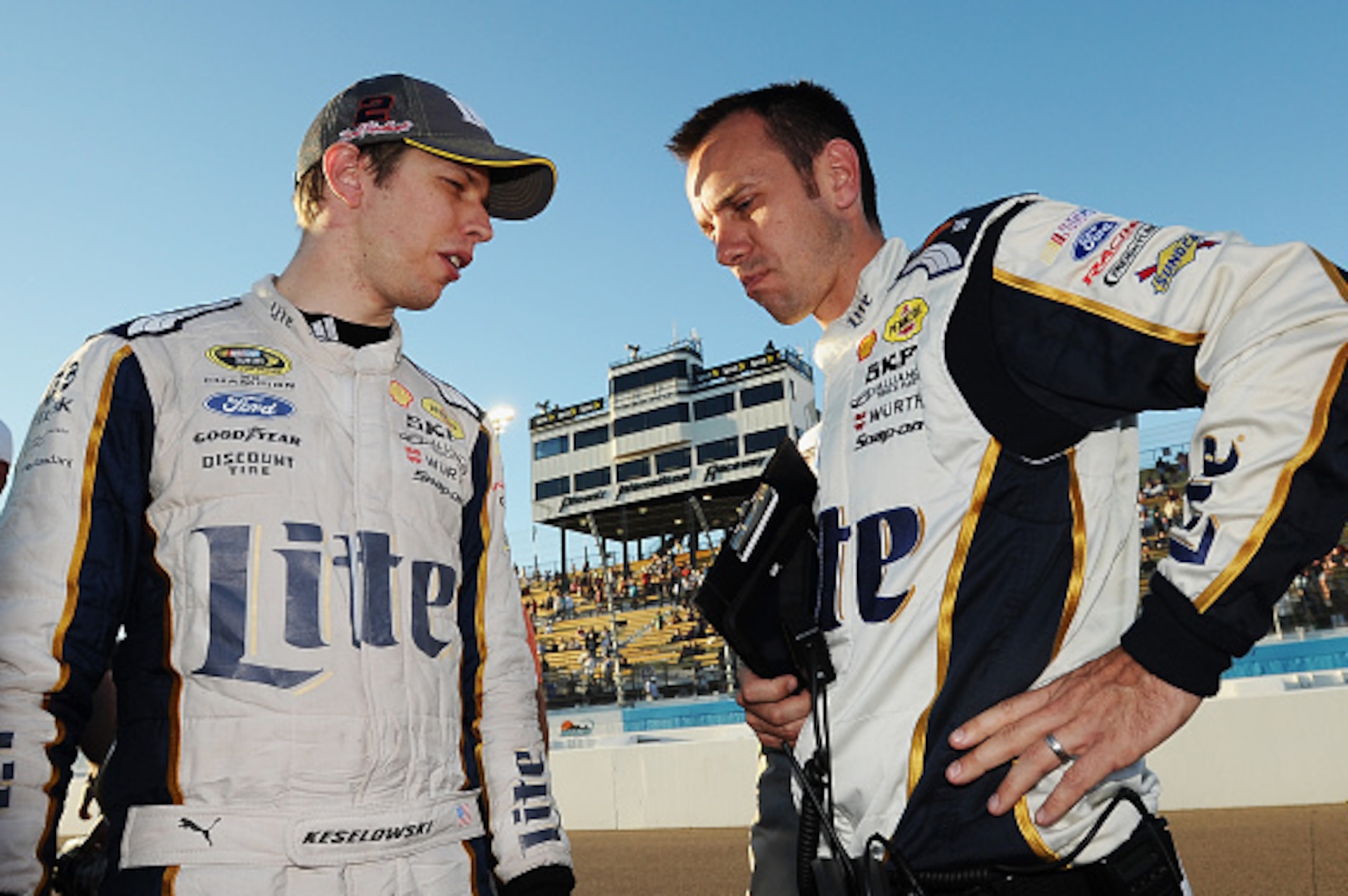 Brad Keselowski (left) talks with crew chief Paul Wolfe after getting eliminated from the Chase at Phoenix.