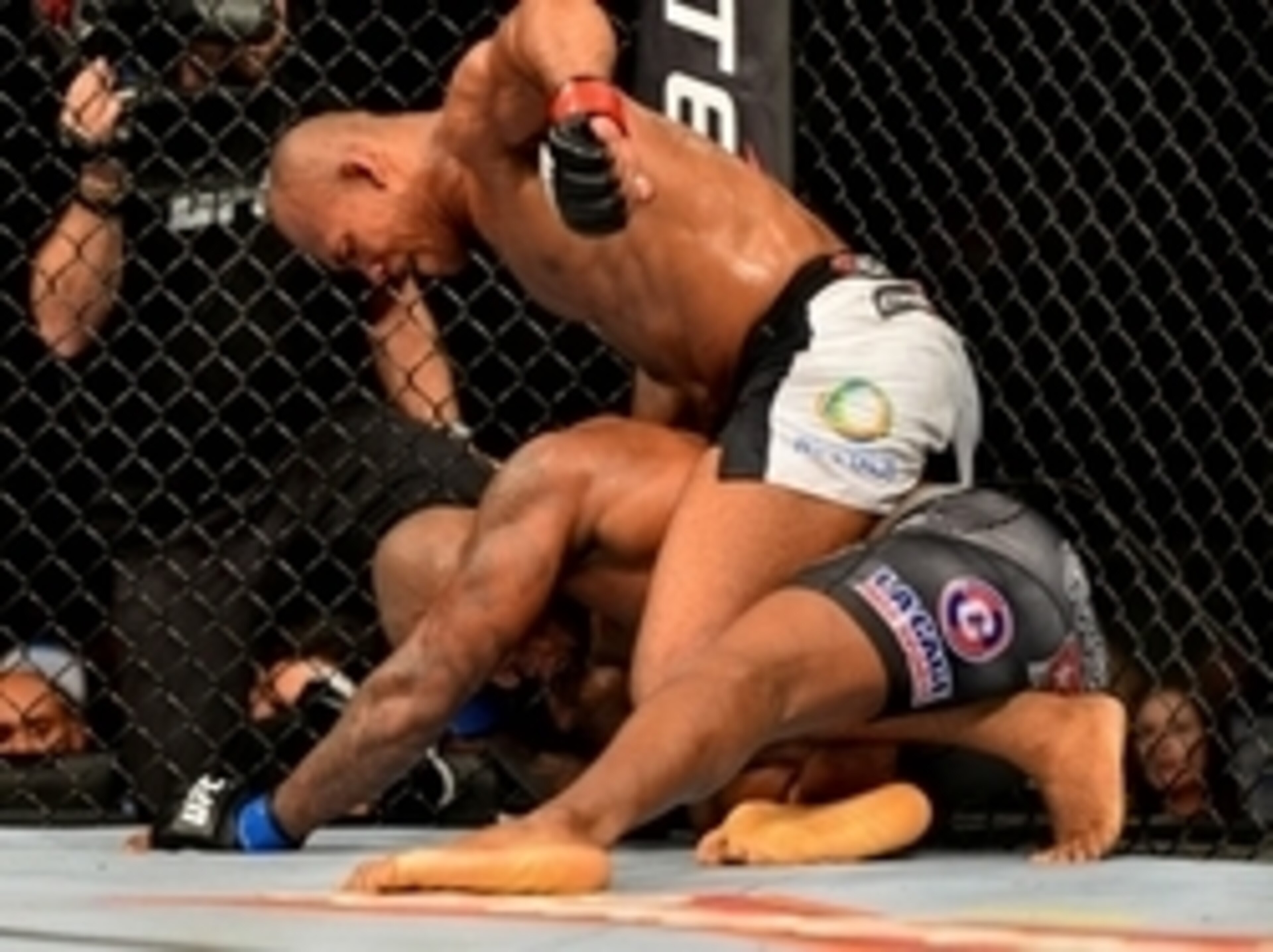 Ronaldo Souza unloading lefts on a grounded Francis Carmont.