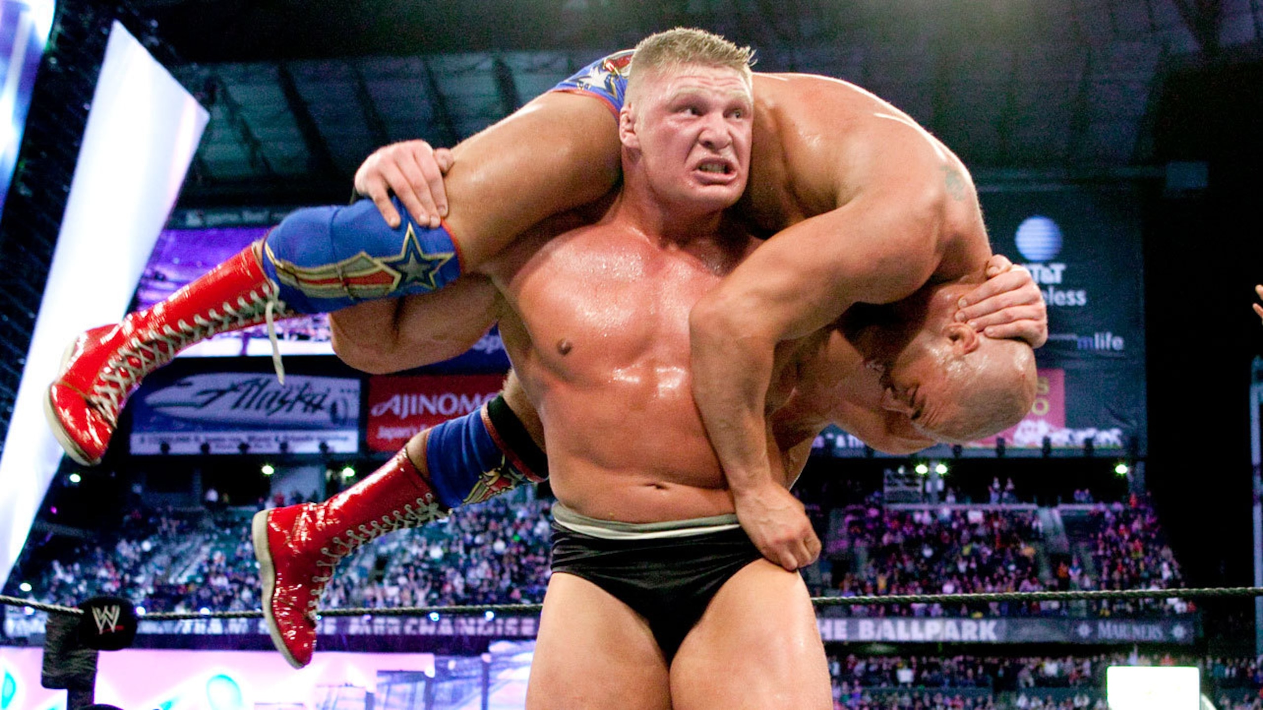 Brock Lesnar lifts Kurt Angle for an F-5.