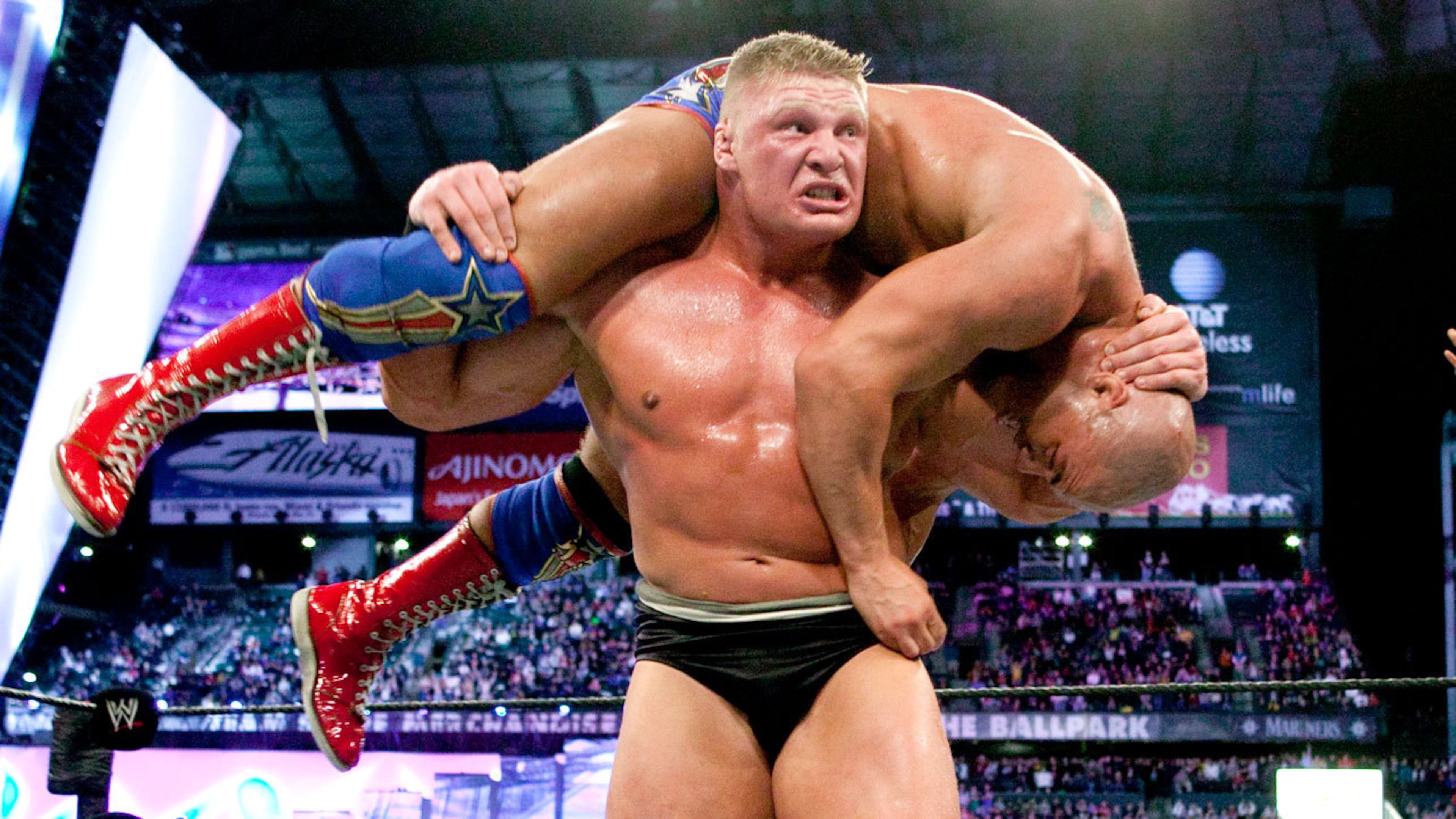 Brock Lesnar lifts Kurt Angle for an F-5.
