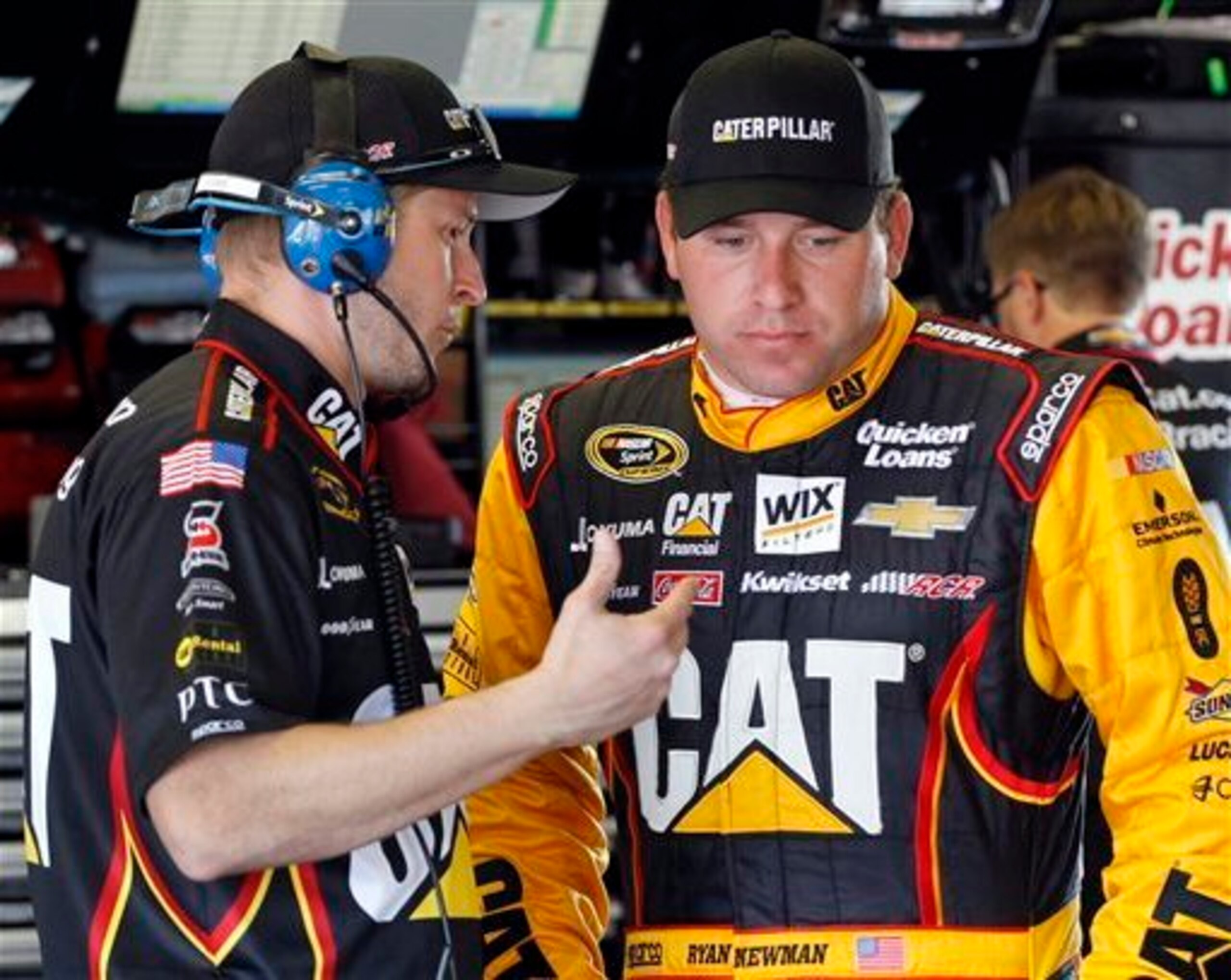 Crew chief Luke Lambert (left) talks with driver Ryan Newman.