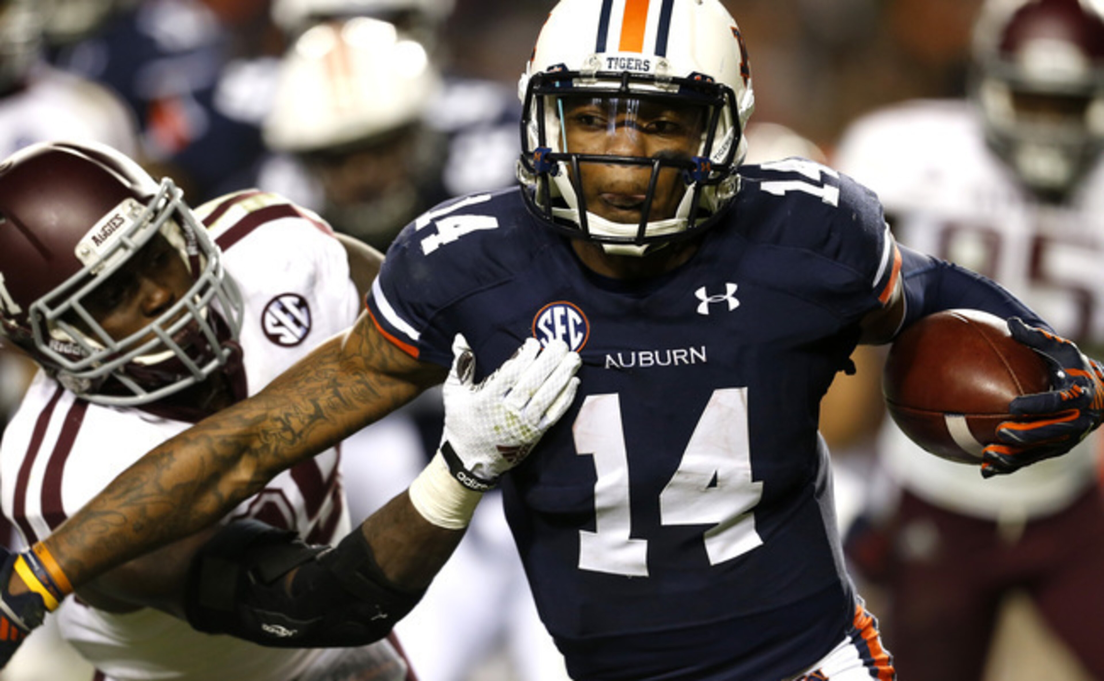 Quarterback Nick Marshall (right) and the Tigers have struggled this season.