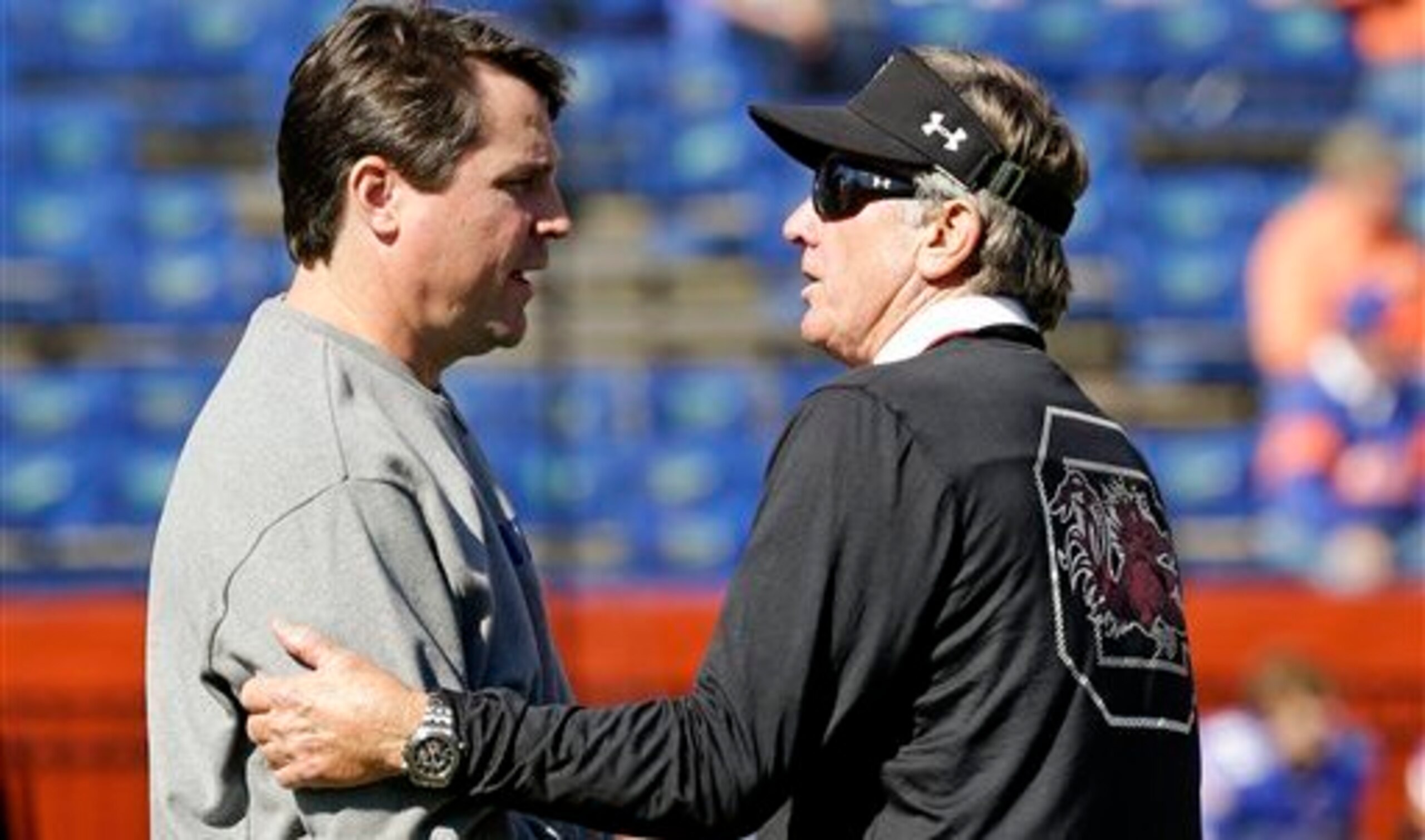 Florida head coach Will Muschamp (left) and South Carolina head coach Steve Spurrier
